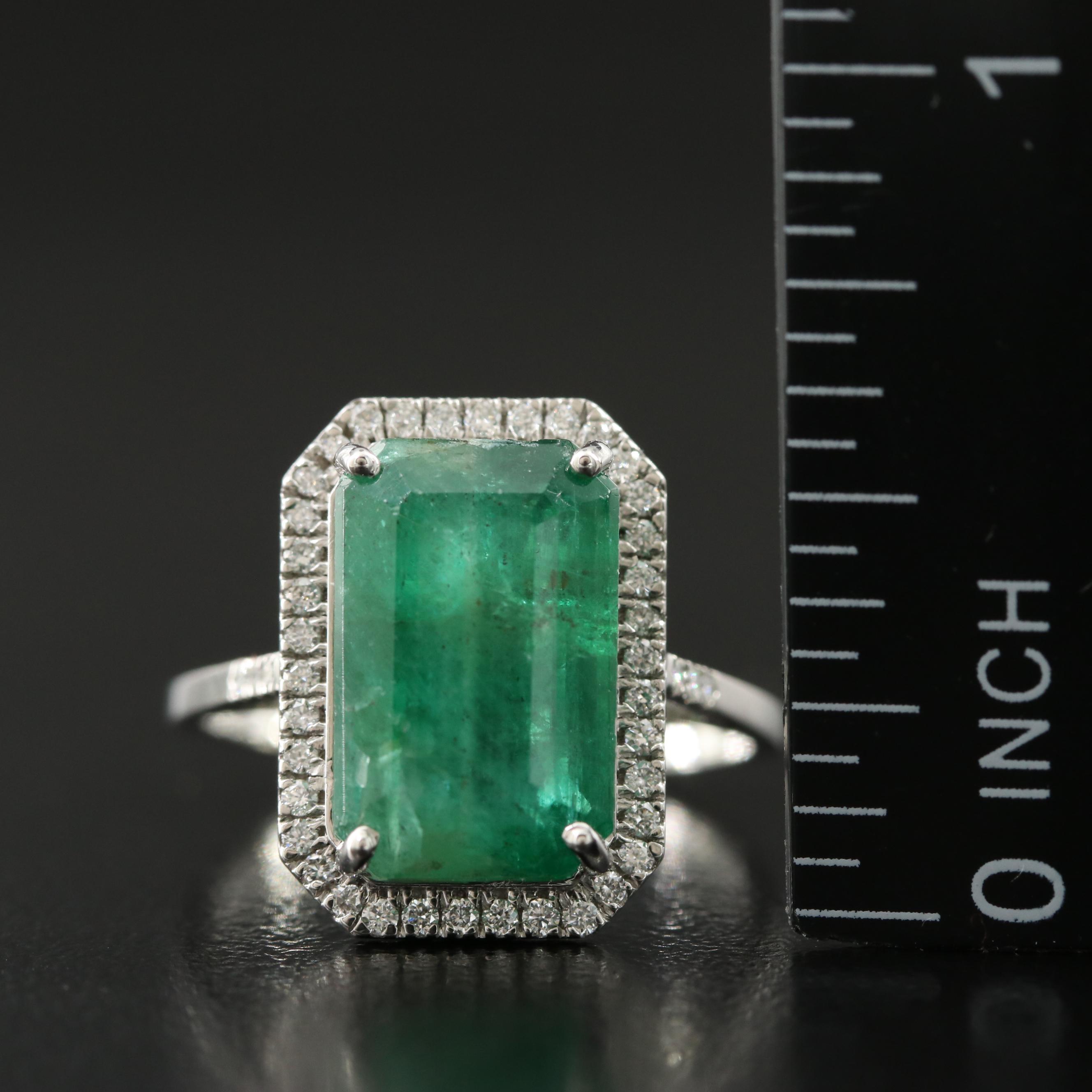 Platinum 6.00 CT Emerald and 0.23 CTW Diamond Ring