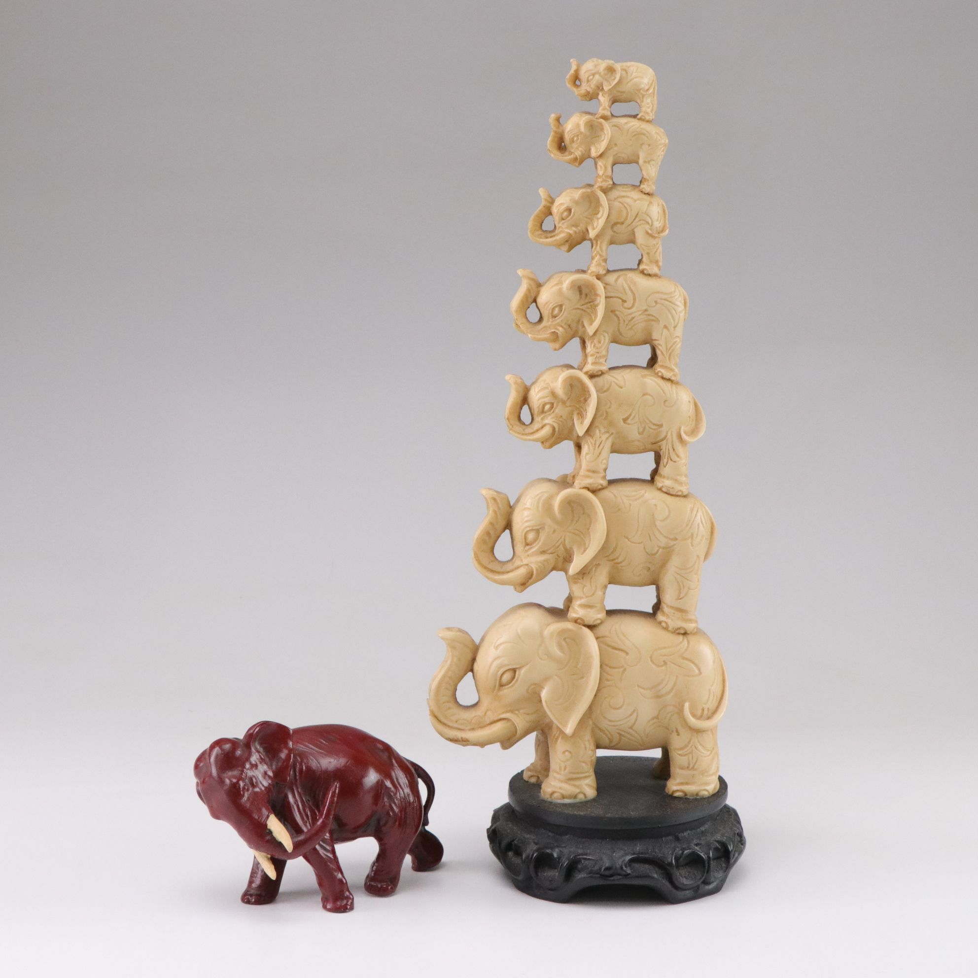 Carved Resin Seven Stacked Elephants with Red Elephant Figurine