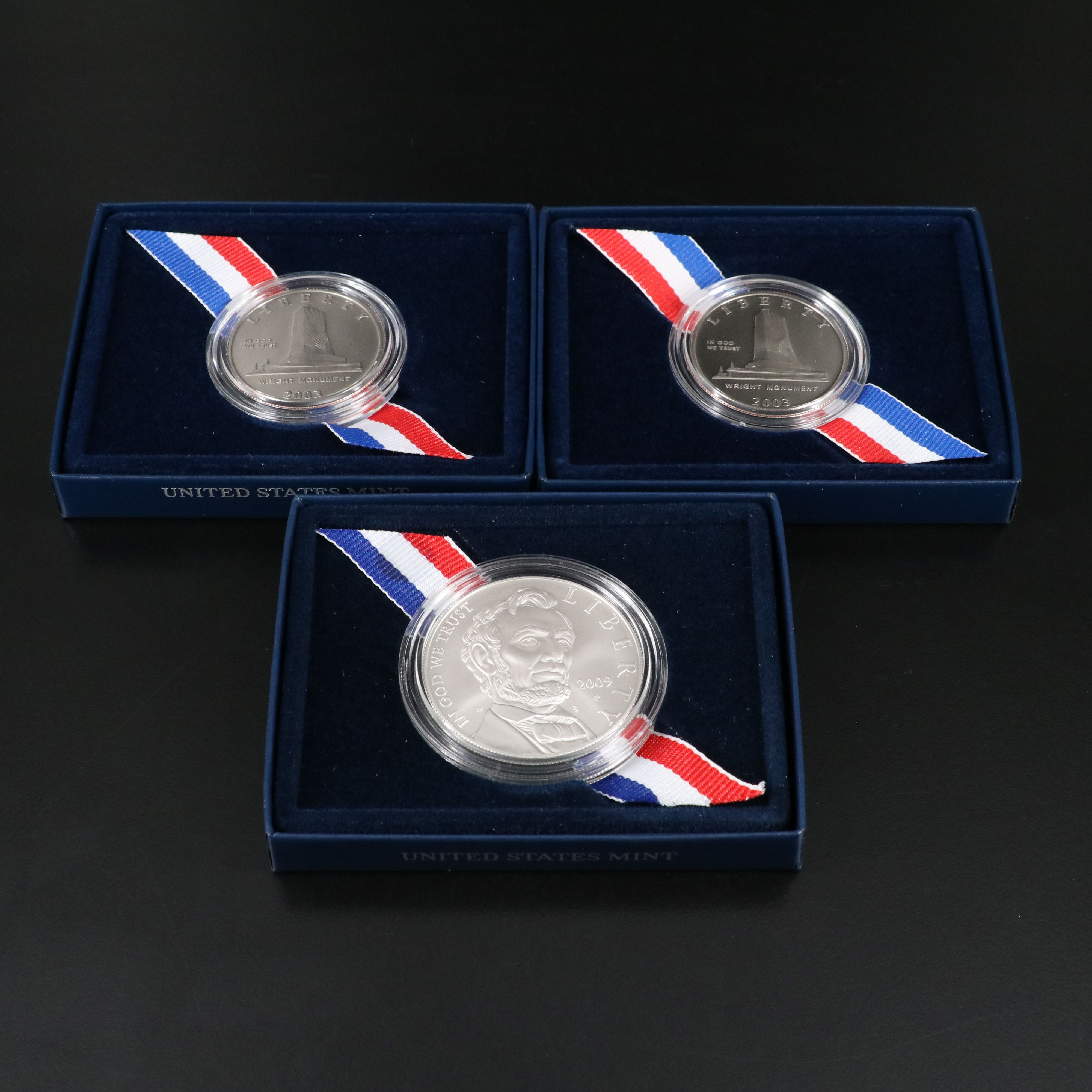 Three Modern Half Dollar and Dollar Commemorative Coins