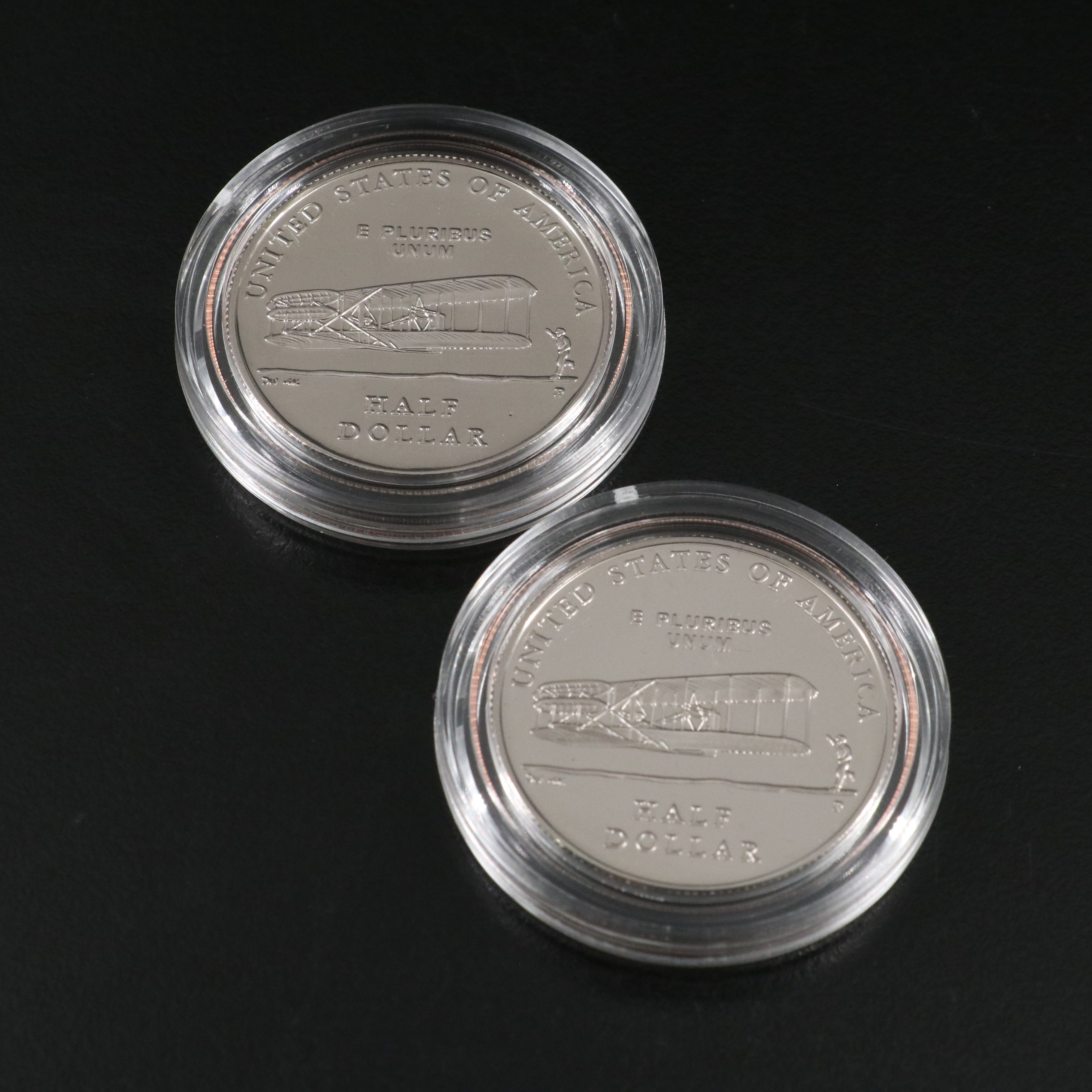 Three Modern Half Dollar and Dollar Commemorative Coins