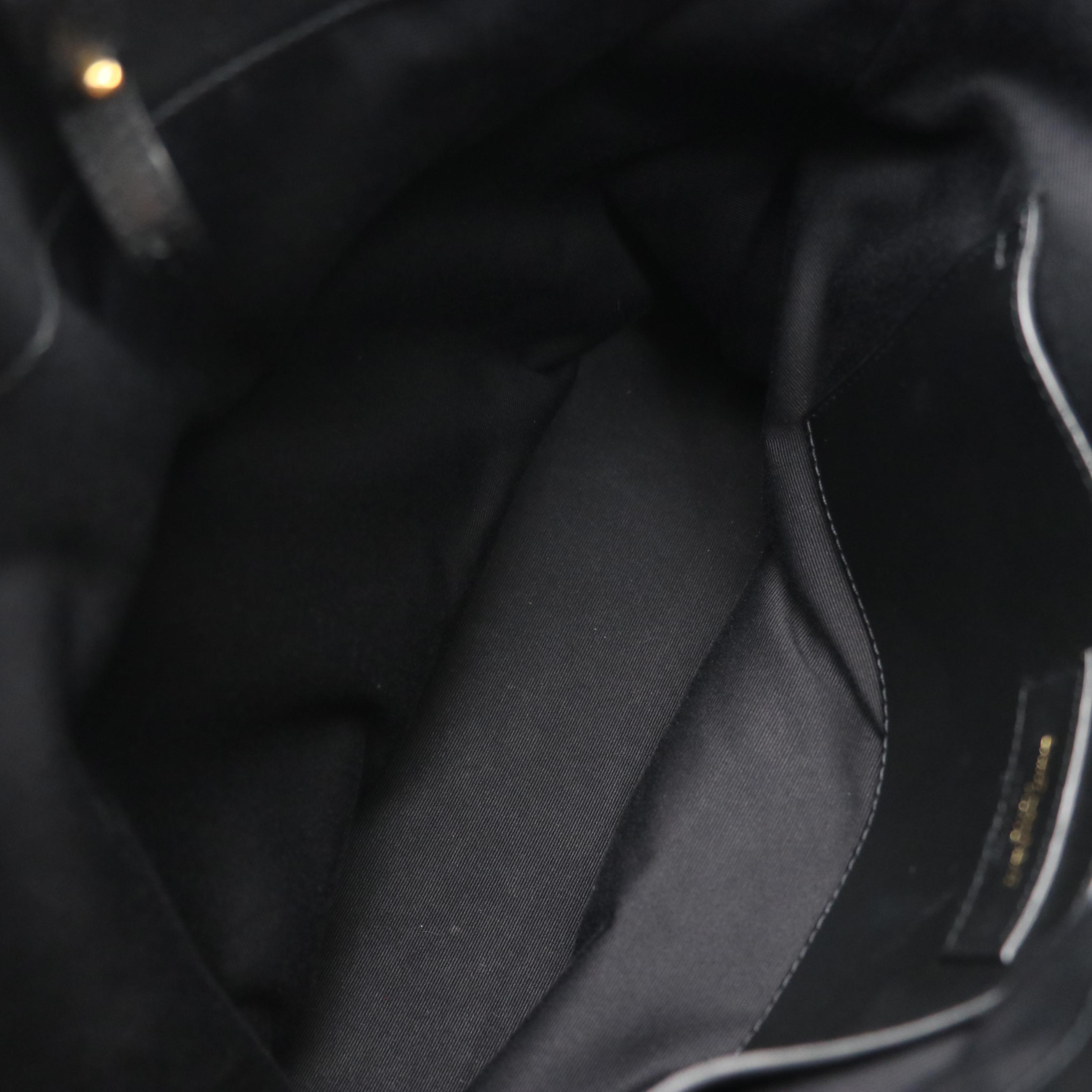 Saint Laurent Bucket Bag in Boucle Raffia and Black Calfskin Leather