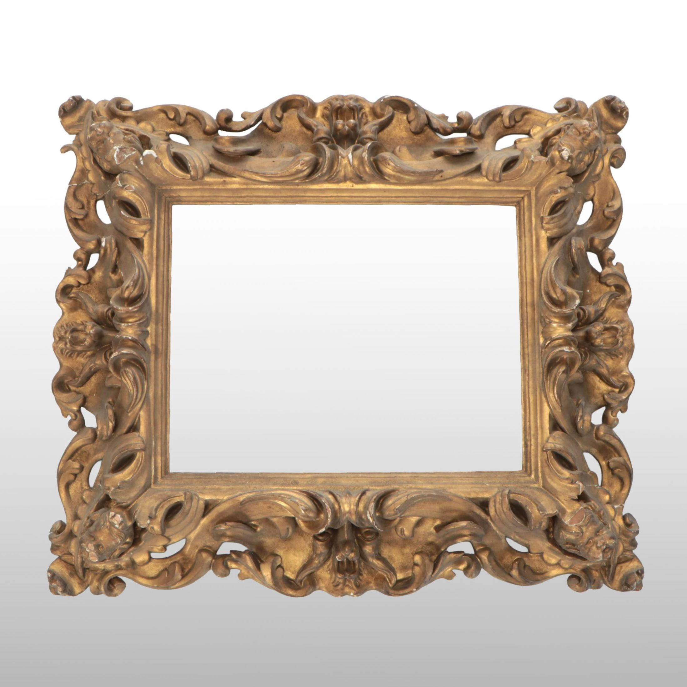 Ornate Giltwood and Gesso Frame with North Wind and Putti Face Medallions