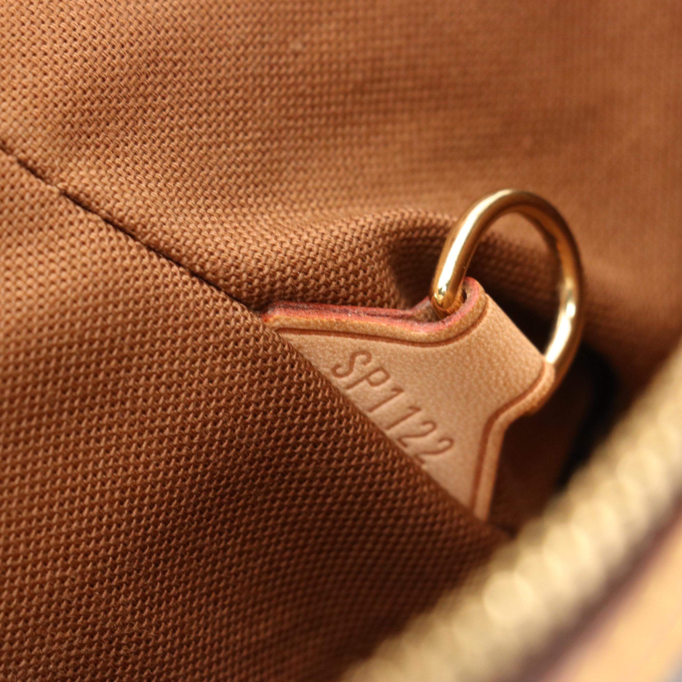 Louis Vuitton Tivoli PM Handbag in Monogram Canvas and Leather