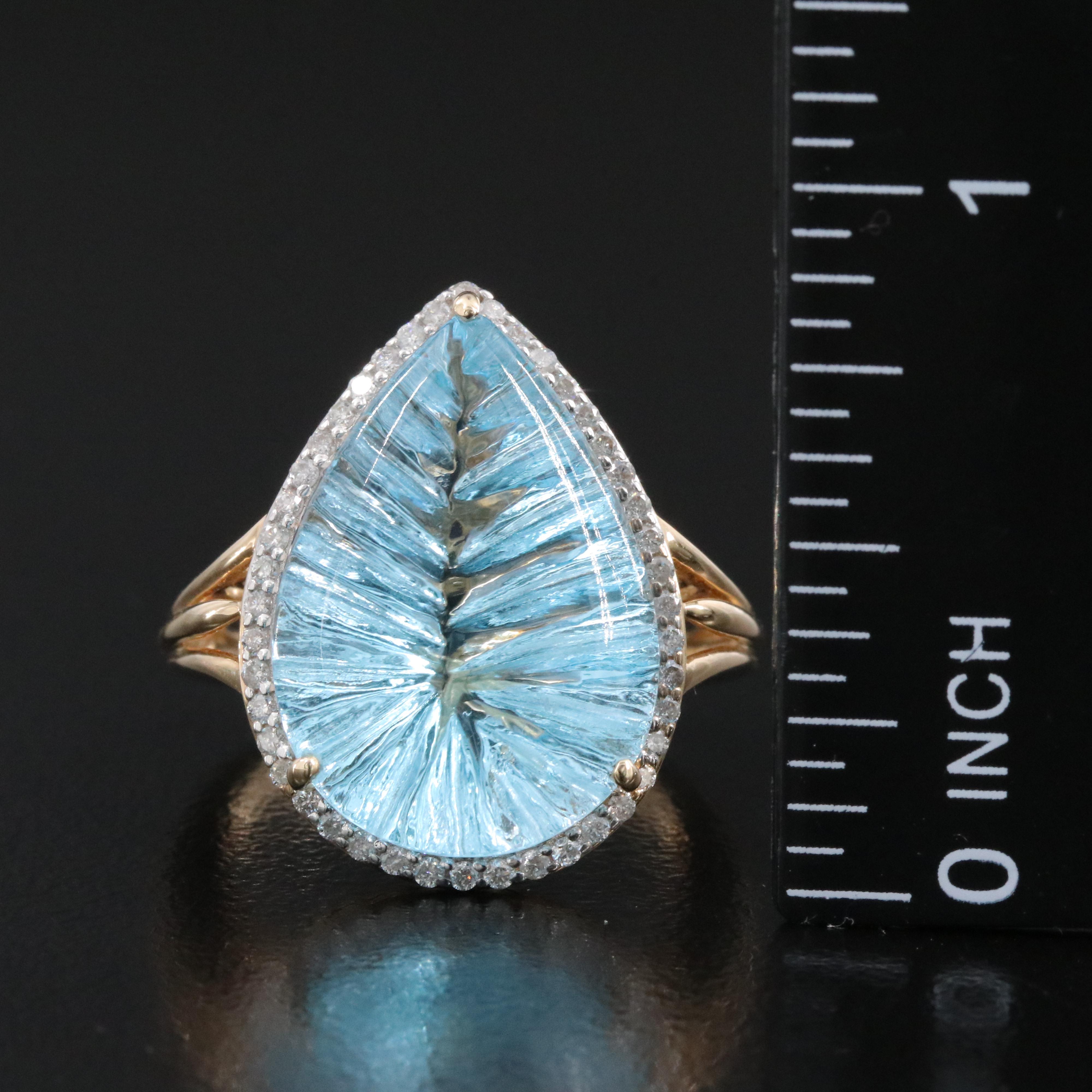 14K 13.92 CT Blue Topaz and 0.26 CTW Diamond Halo Ring