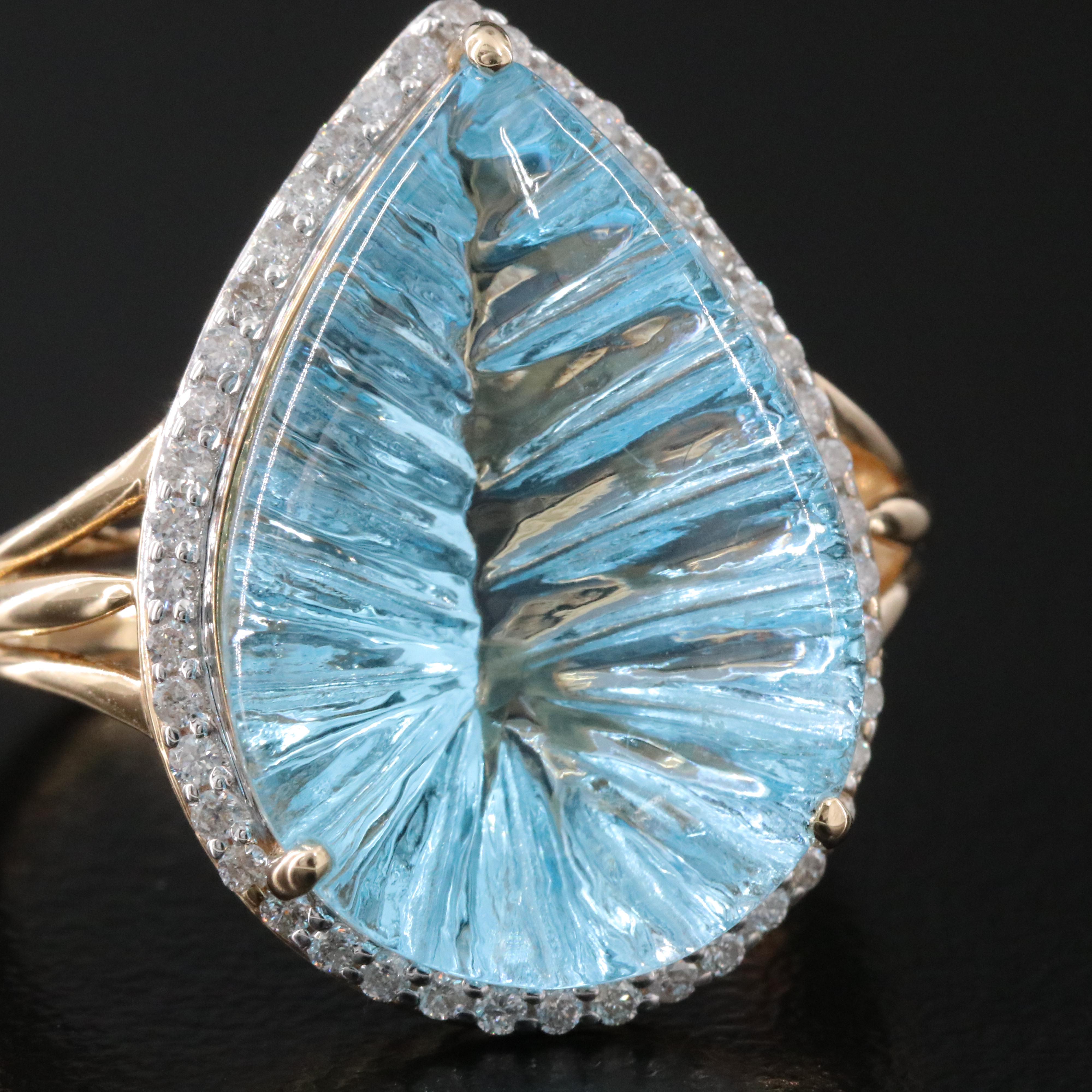 14K 13.92 CT Blue Topaz and 0.26 CTW Diamond Halo Ring