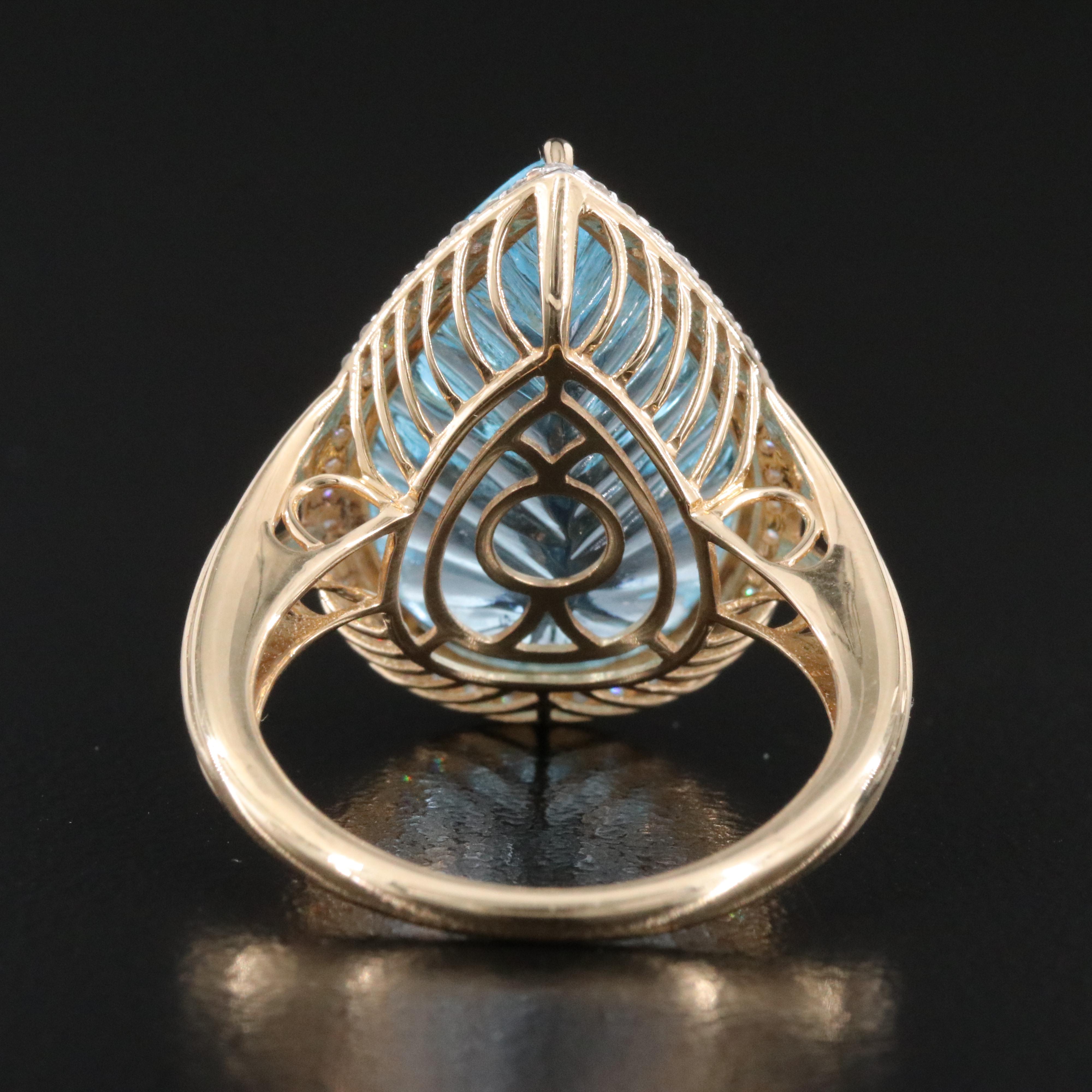 14K 13.92 CT Blue Topaz and 0.26 CTW Diamond Halo Ring