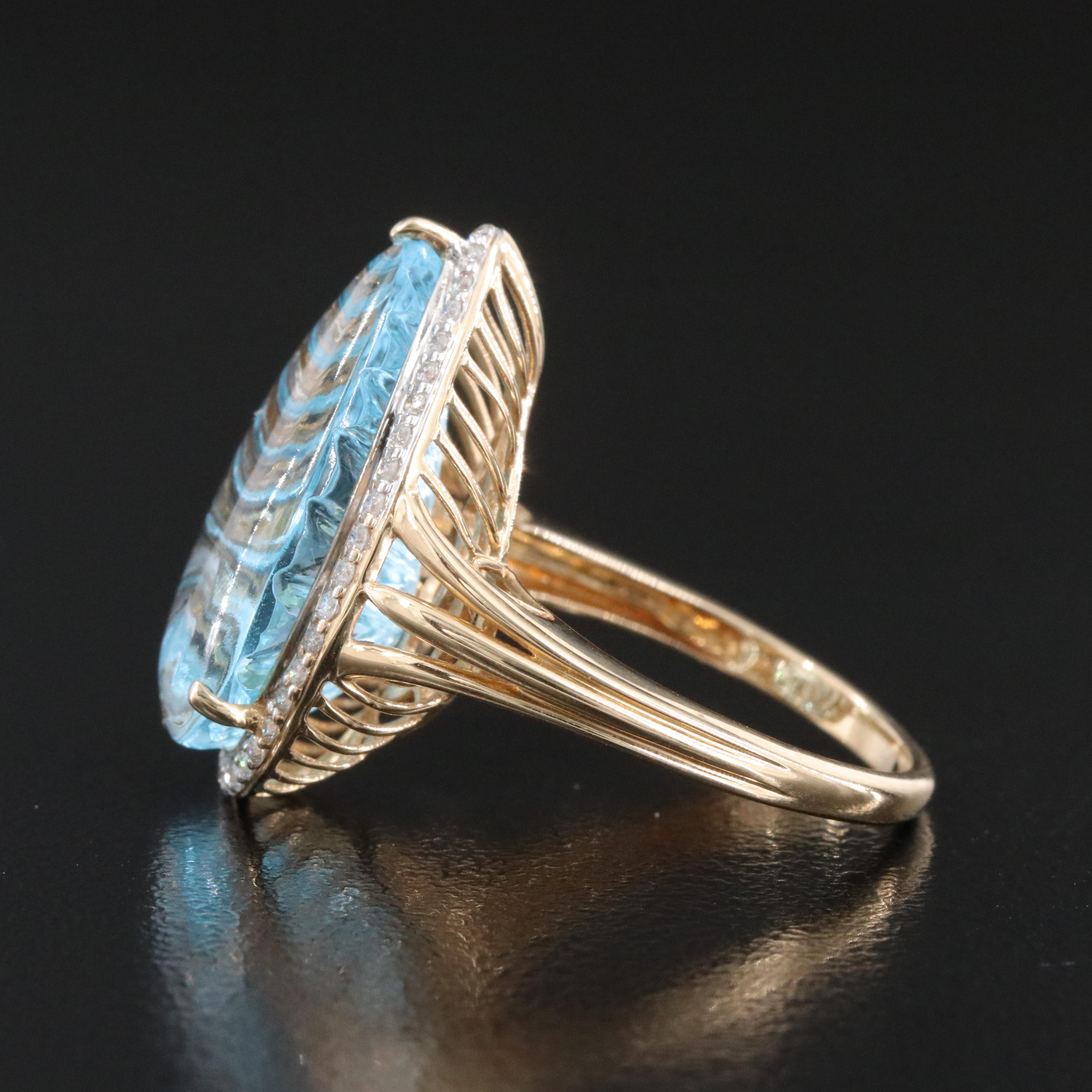 14K 13.92 CT Blue Topaz and 0.26 CTW Diamond Halo Ring