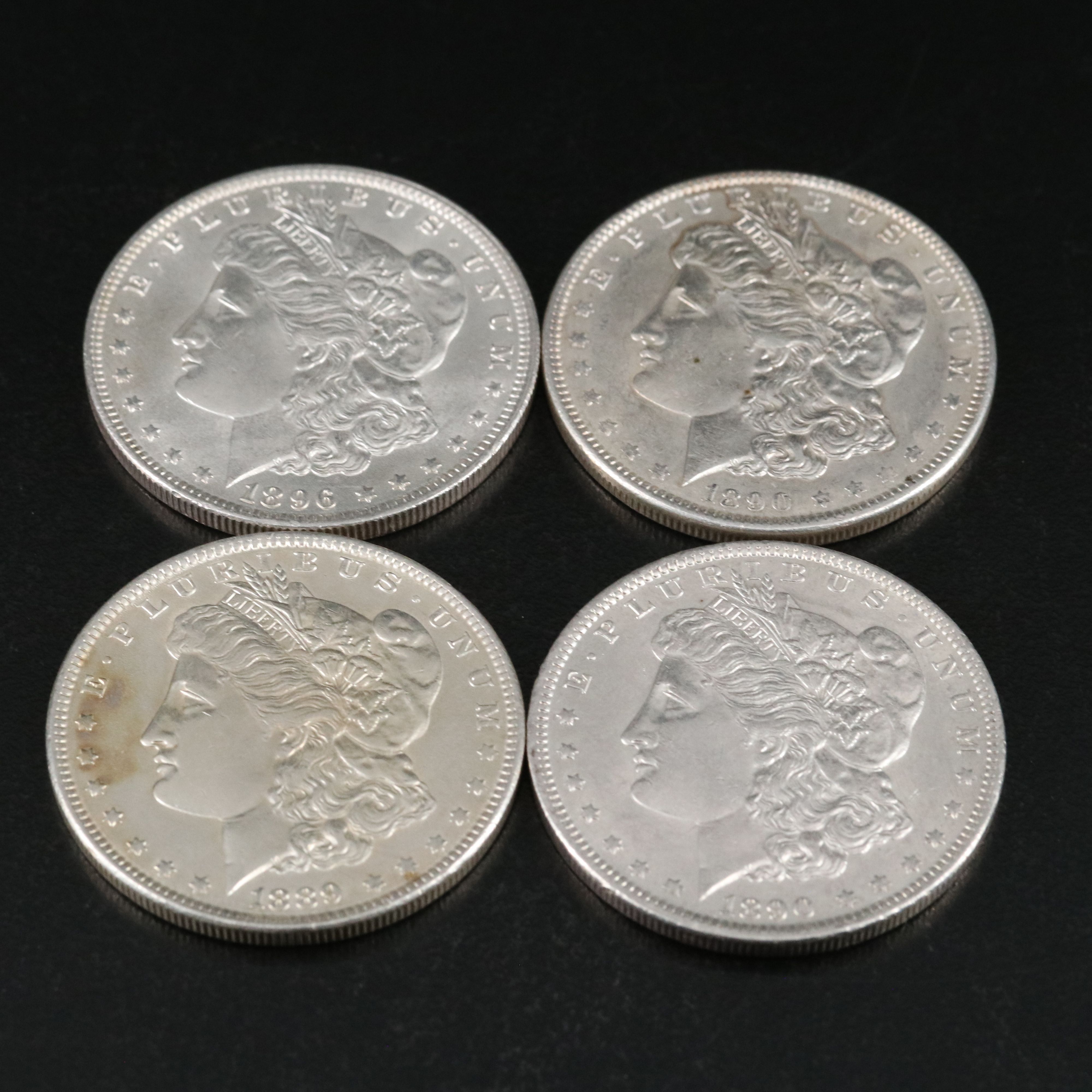 Group of Thirteen Morgan Silver Dollars Including an 1891-O