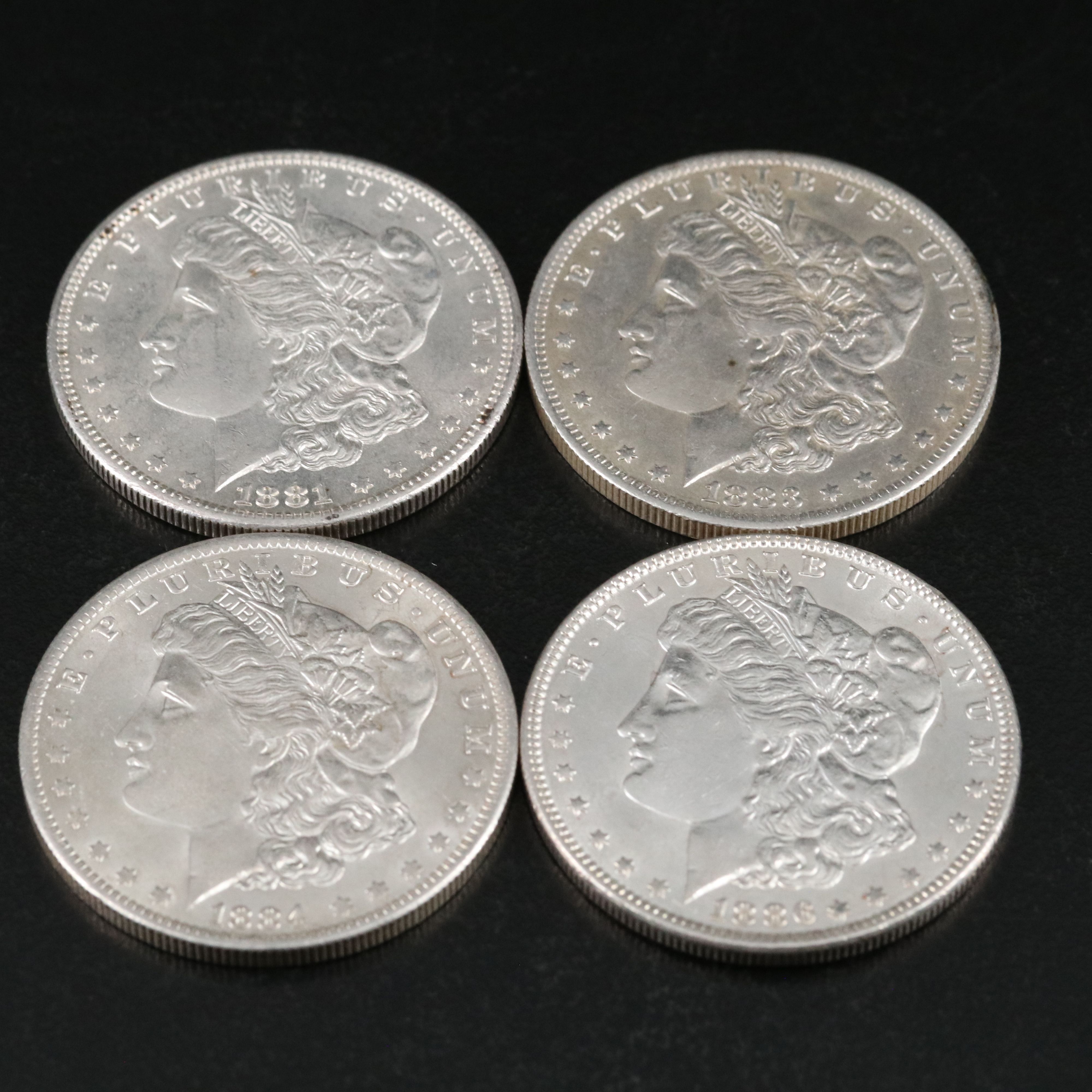 Group of Thirteen Morgan Silver Dollars Including an 1891-O