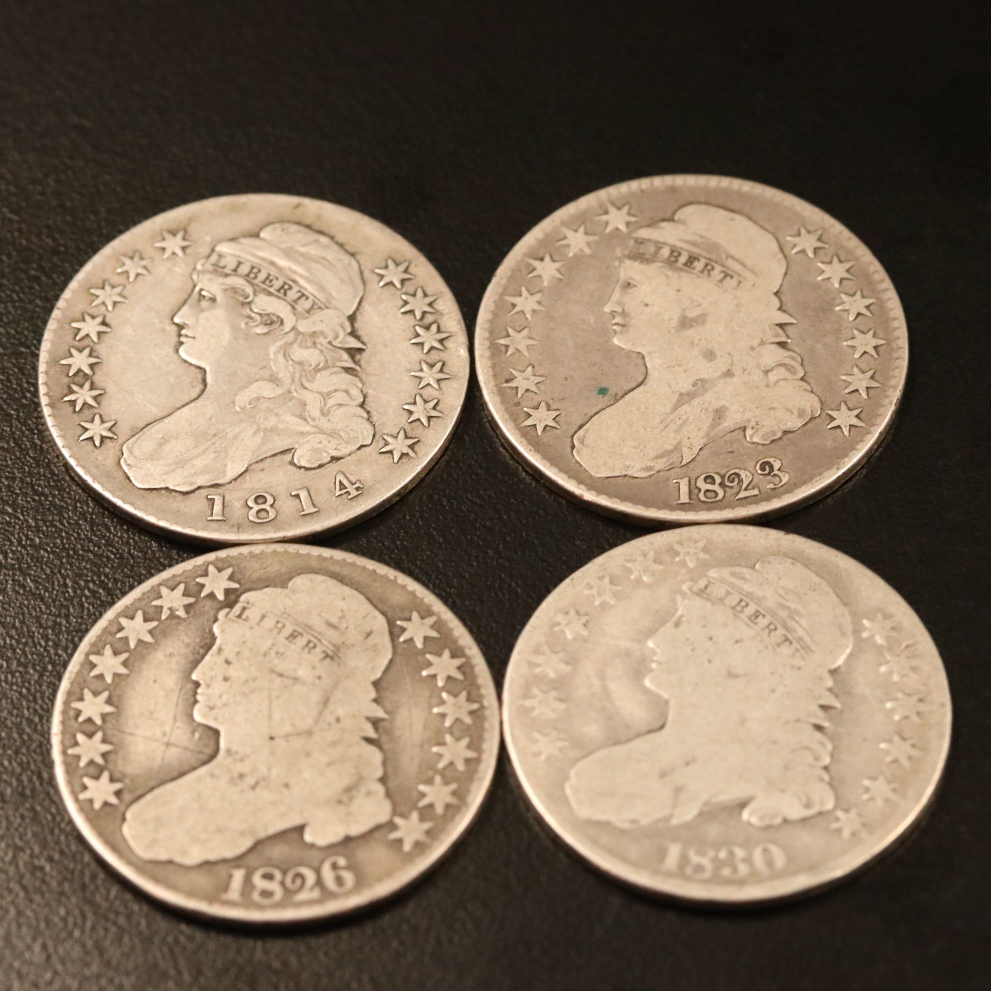 Four Capped Bust Silver Half Dollars Including an 1814
