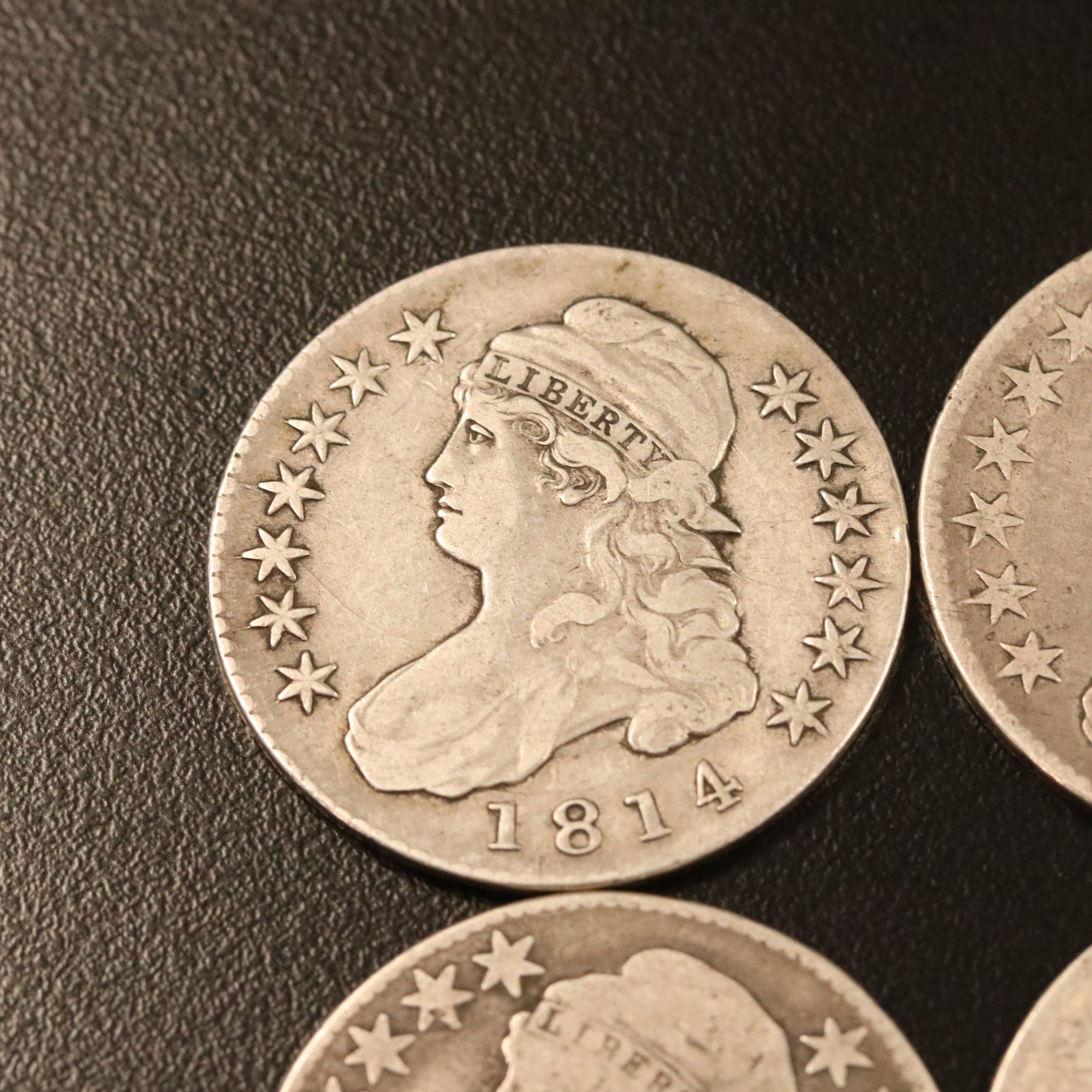 Four Capped Bust Silver Half Dollars Including an 1814
