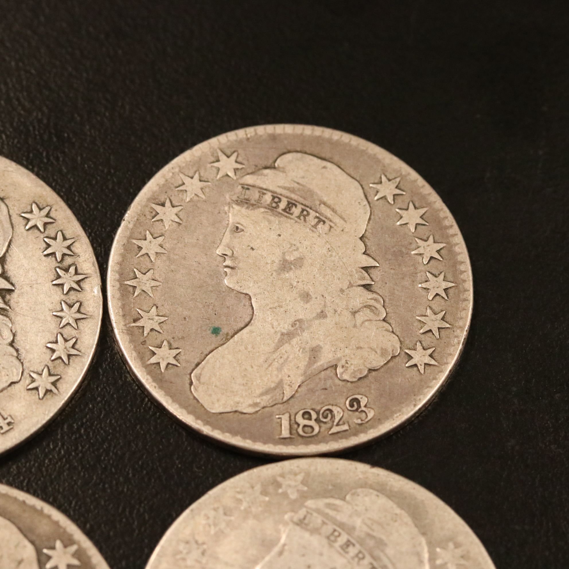 Four Capped Bust Silver Half Dollars Including an 1814