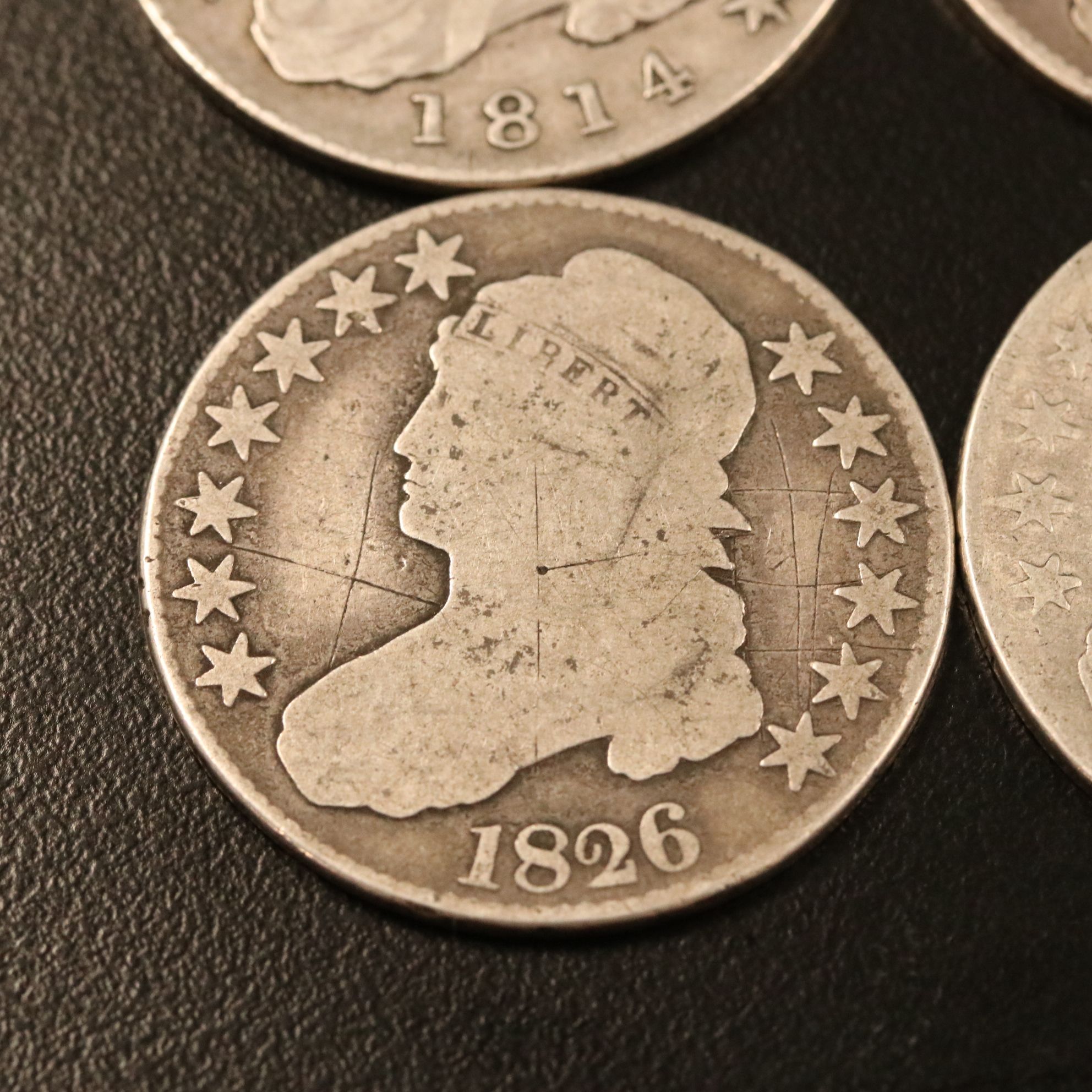 Four Capped Bust Silver Half Dollars Including an 1814