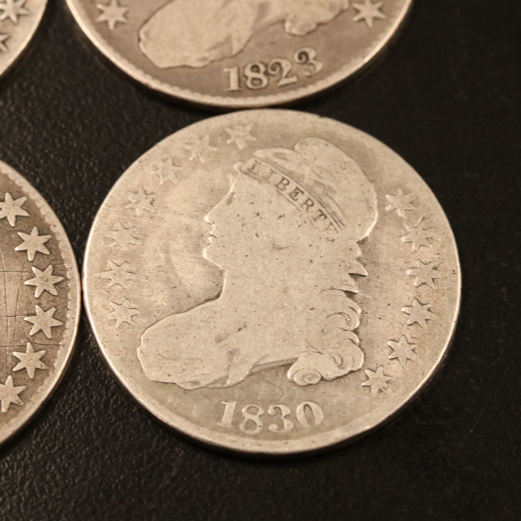 Four Capped Bust Silver Half Dollars Including an 1814