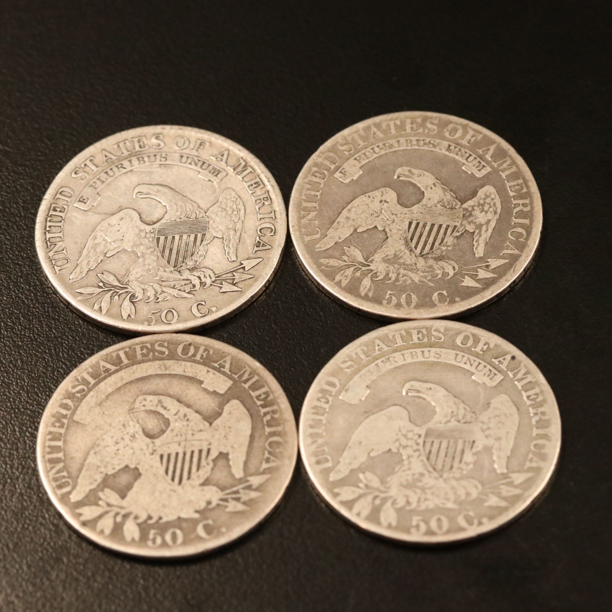 Four Capped Bust Silver Half Dollars Including an 1814