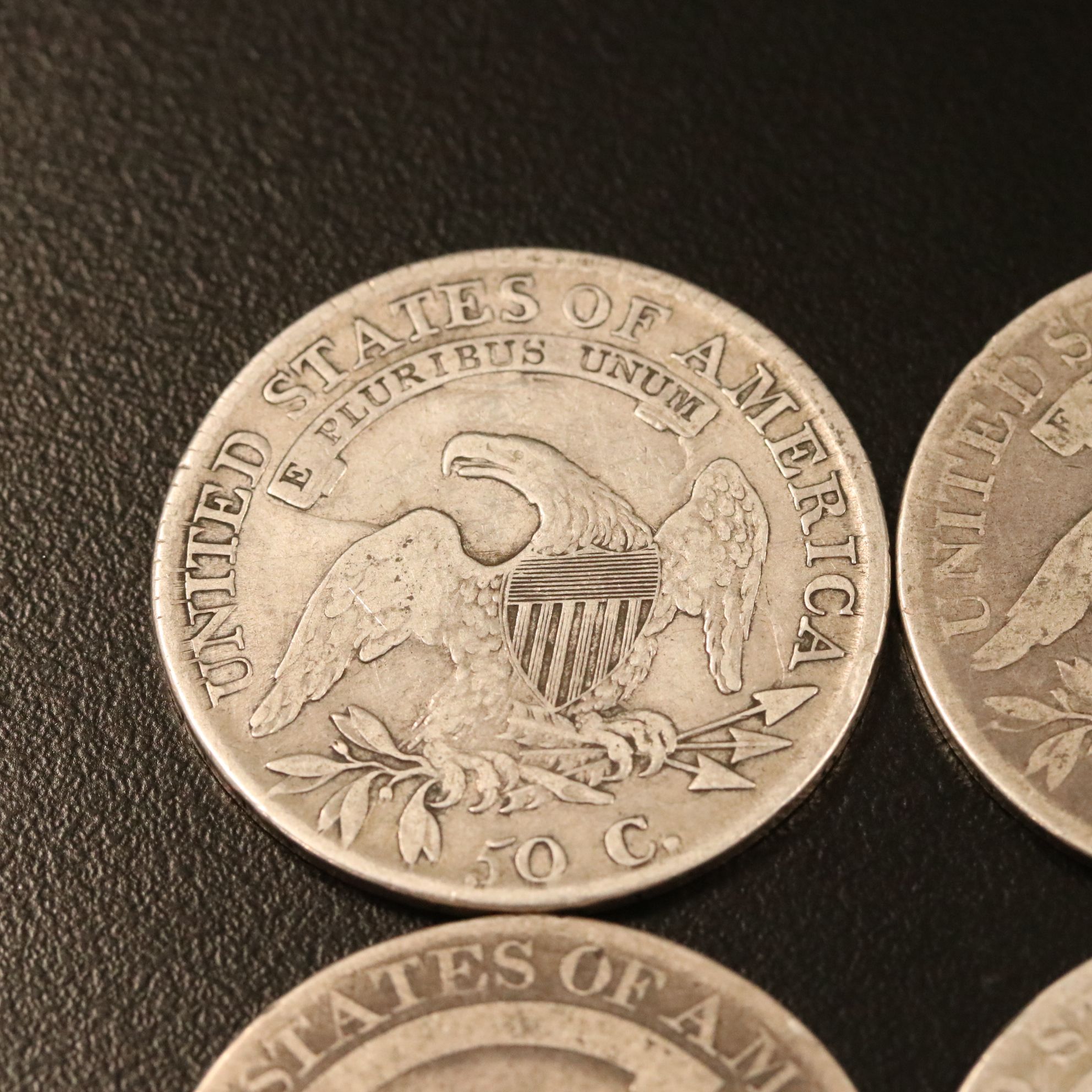 Four Capped Bust Silver Half Dollars Including an 1814