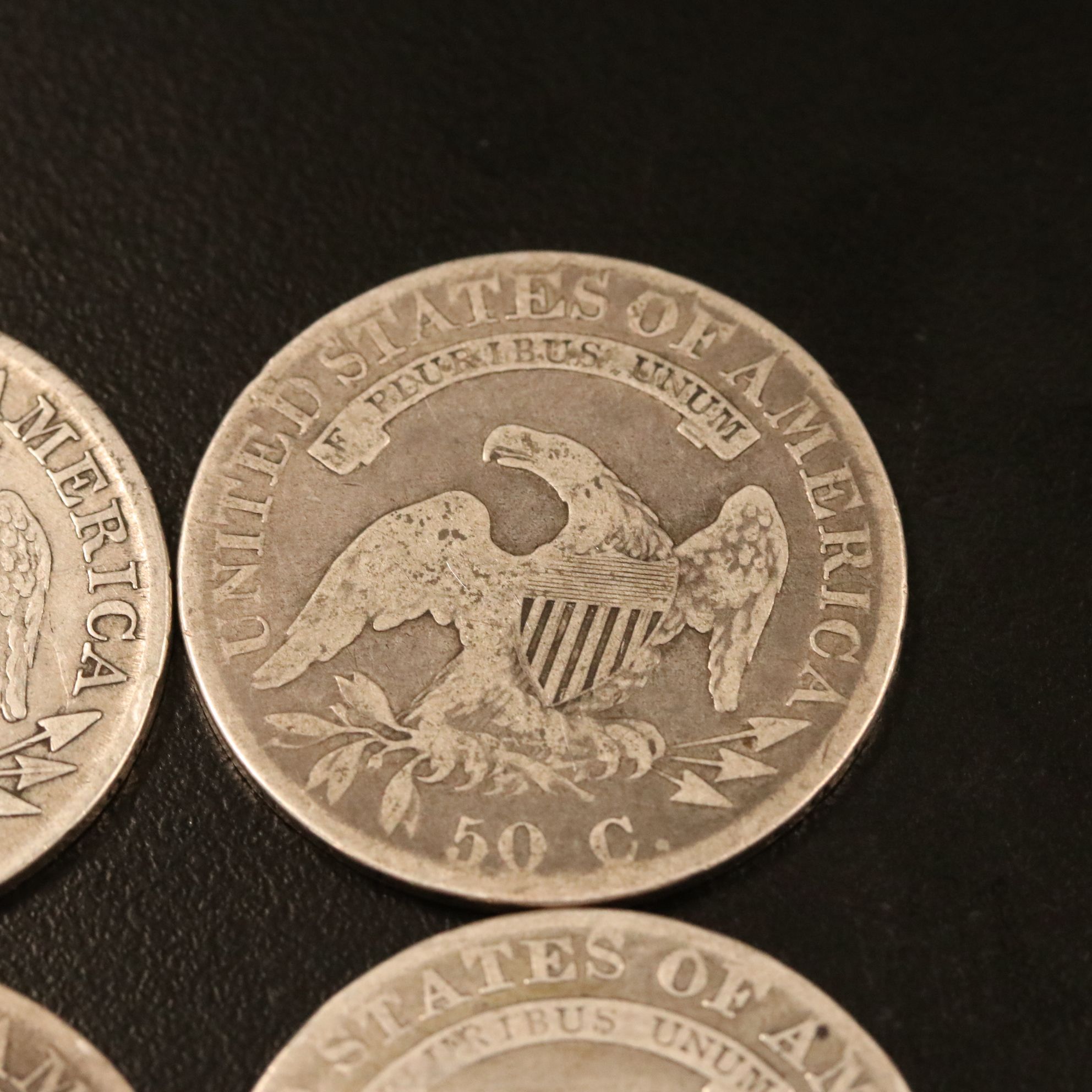 Four Capped Bust Silver Half Dollars Including an 1814