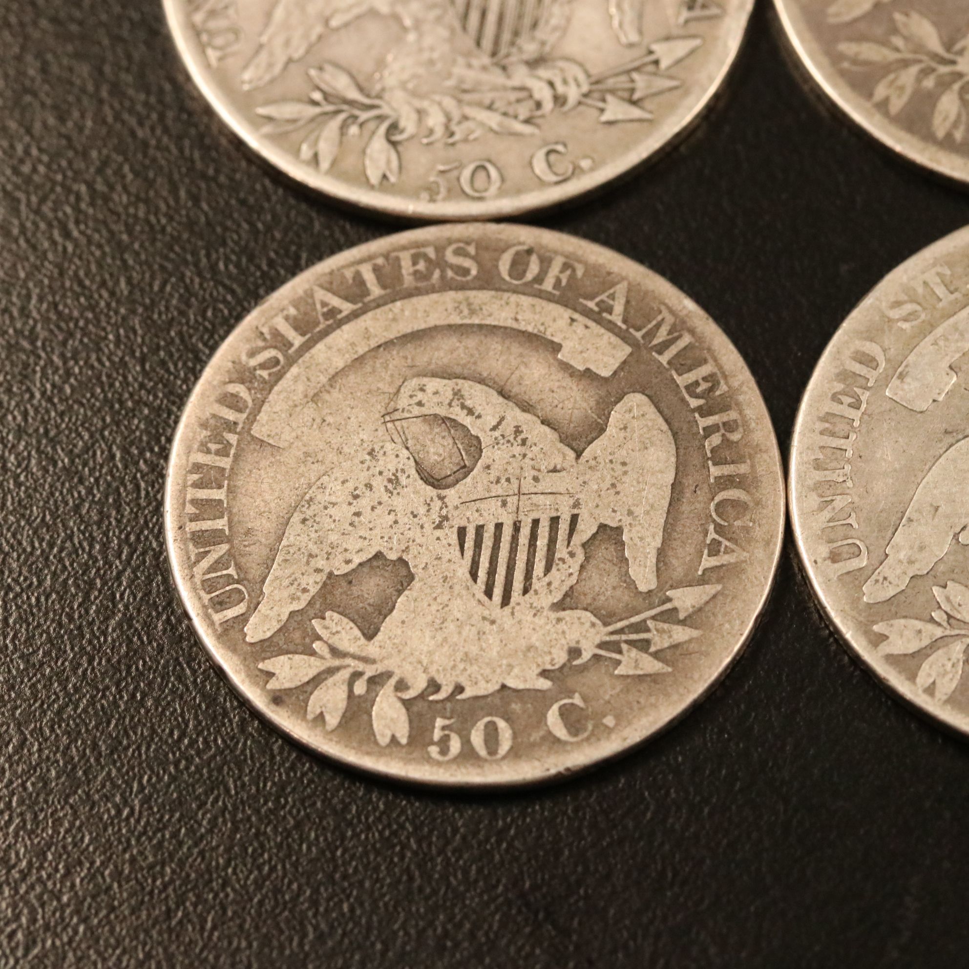 Four Capped Bust Silver Half Dollars Including an 1814