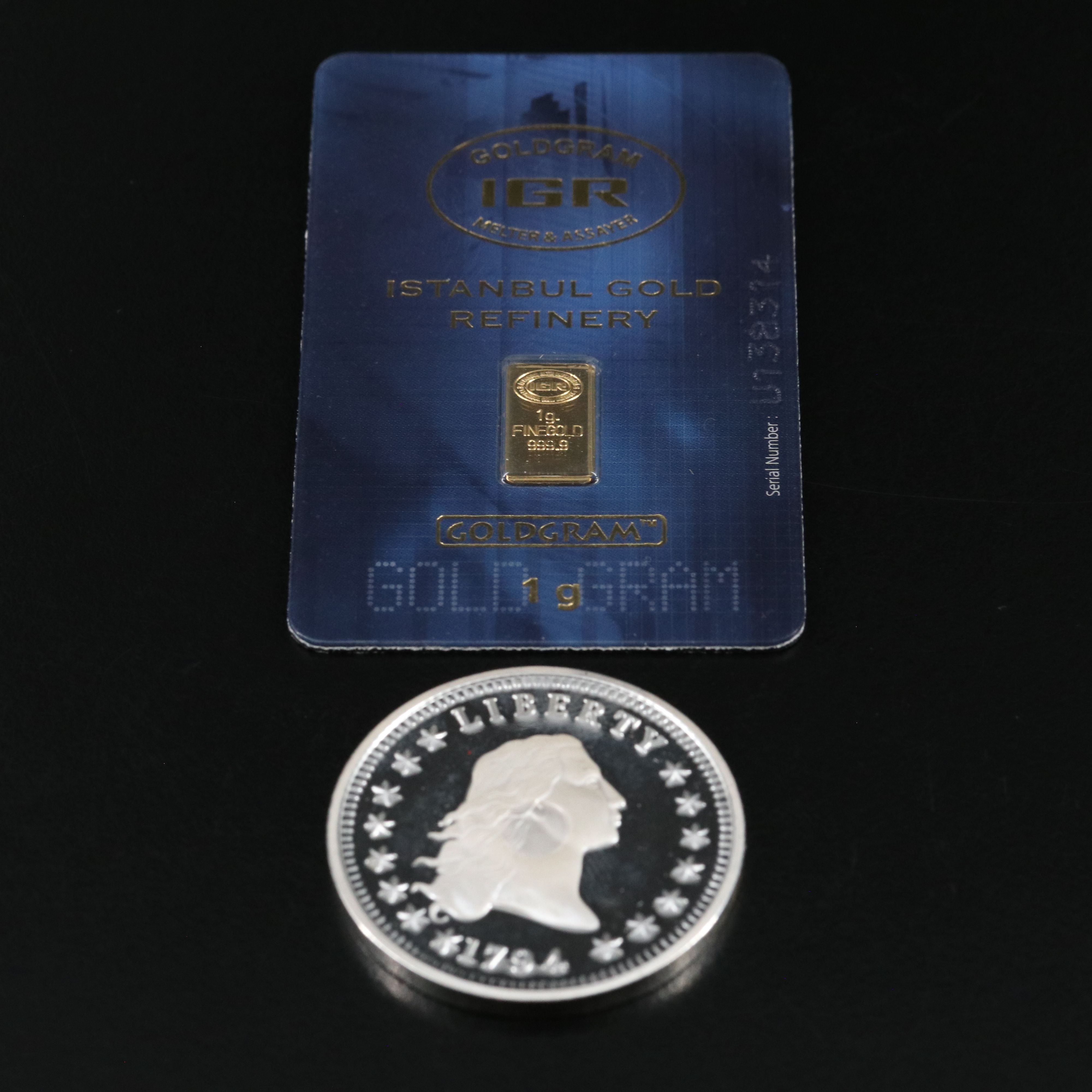 One Gram .9999 Gold Bar and a 1794 Silver Dollar Replica