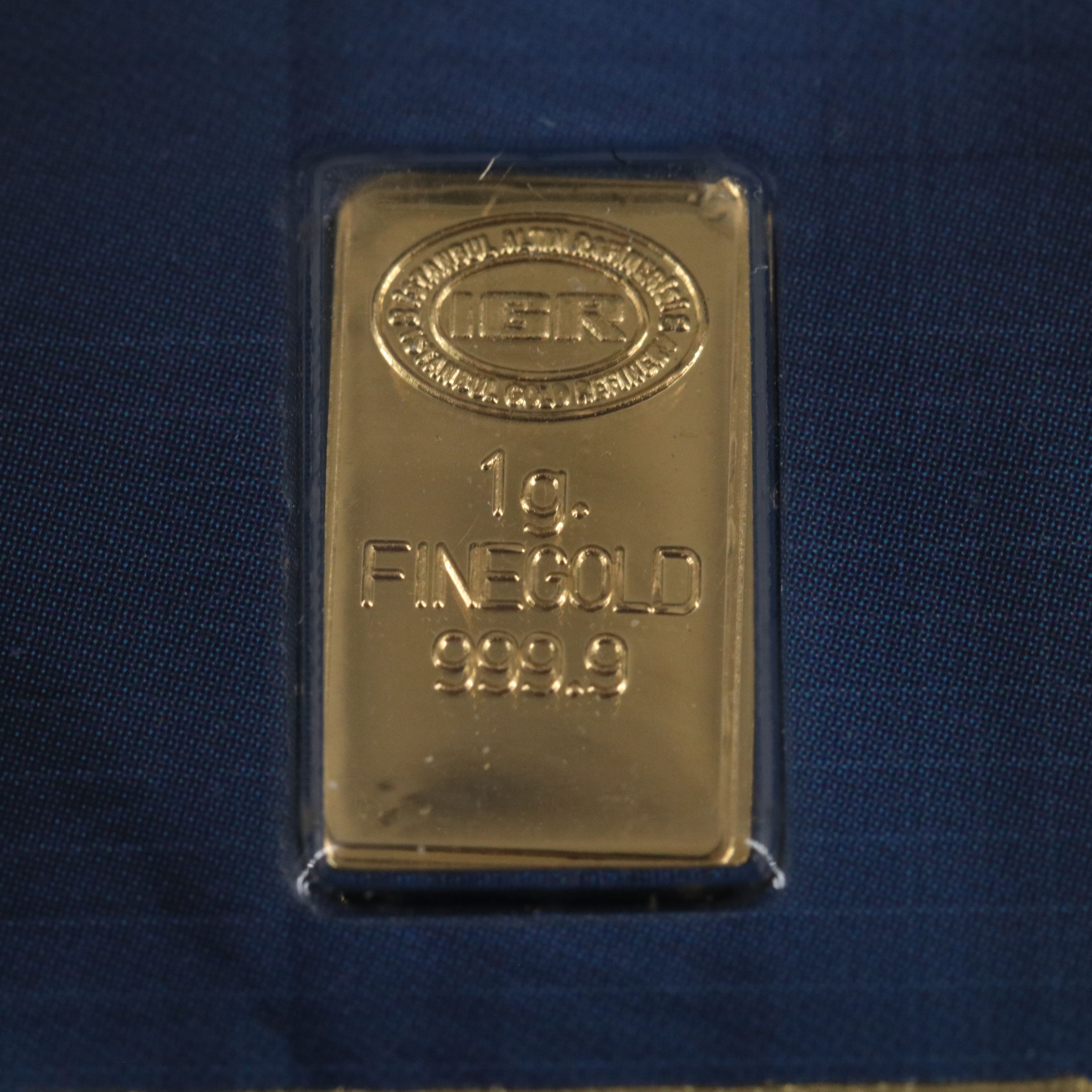 One Gram .9999 Gold Bar and a 1794 Silver Dollar Replica