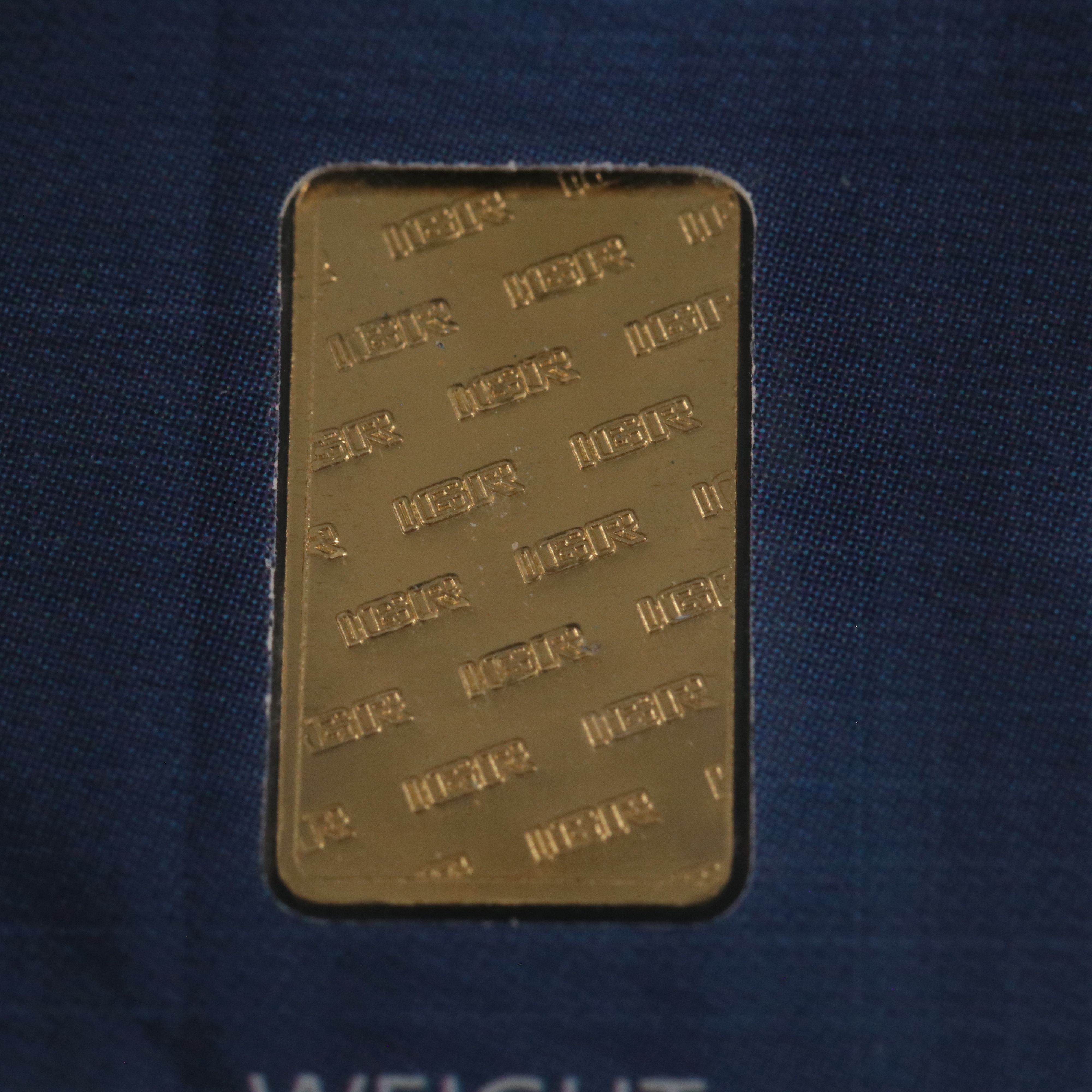 One Gram .9999 Gold Bar and a 1794 Silver Dollar Replica