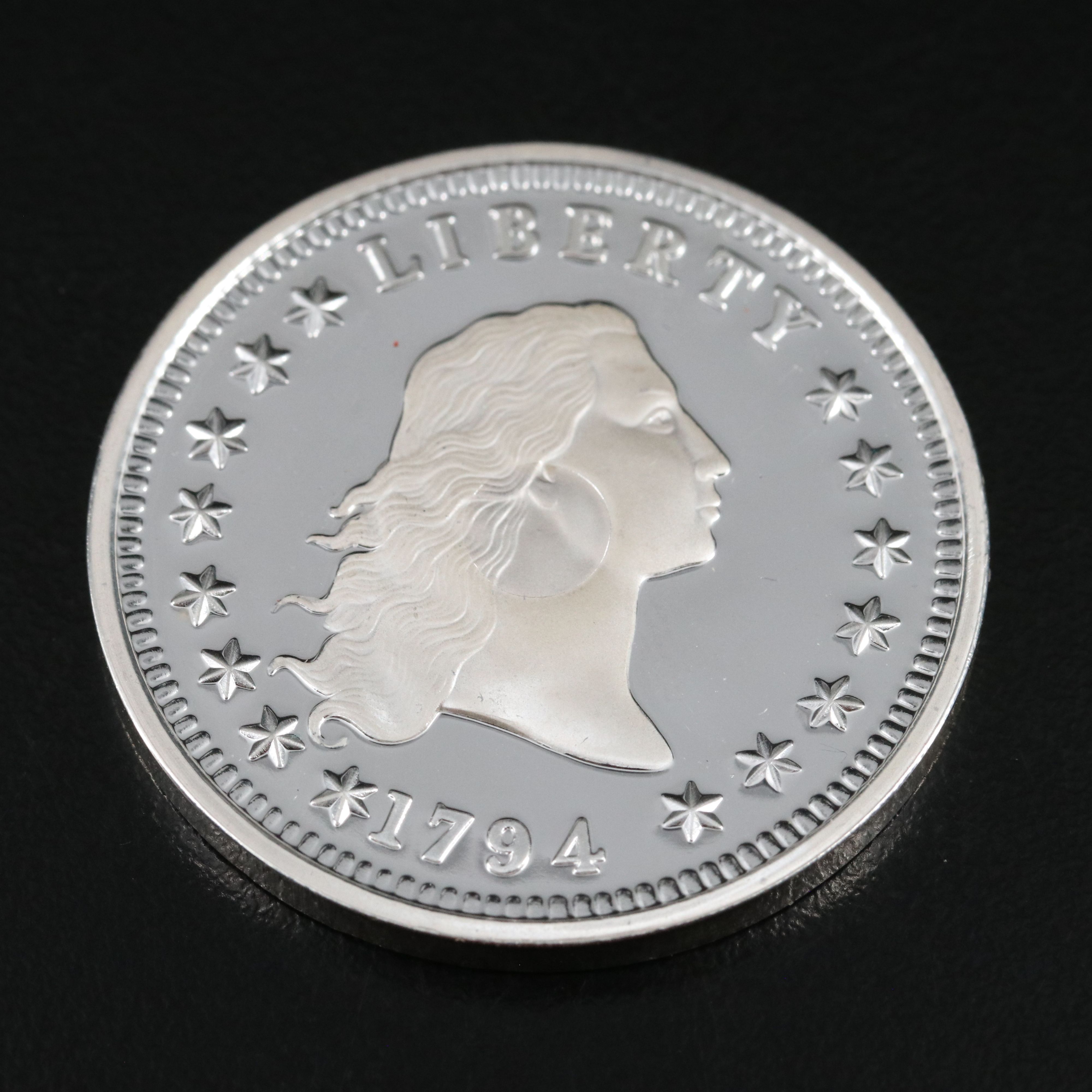 One Gram .9999 Gold Bar and a 1794 Silver Dollar Replica