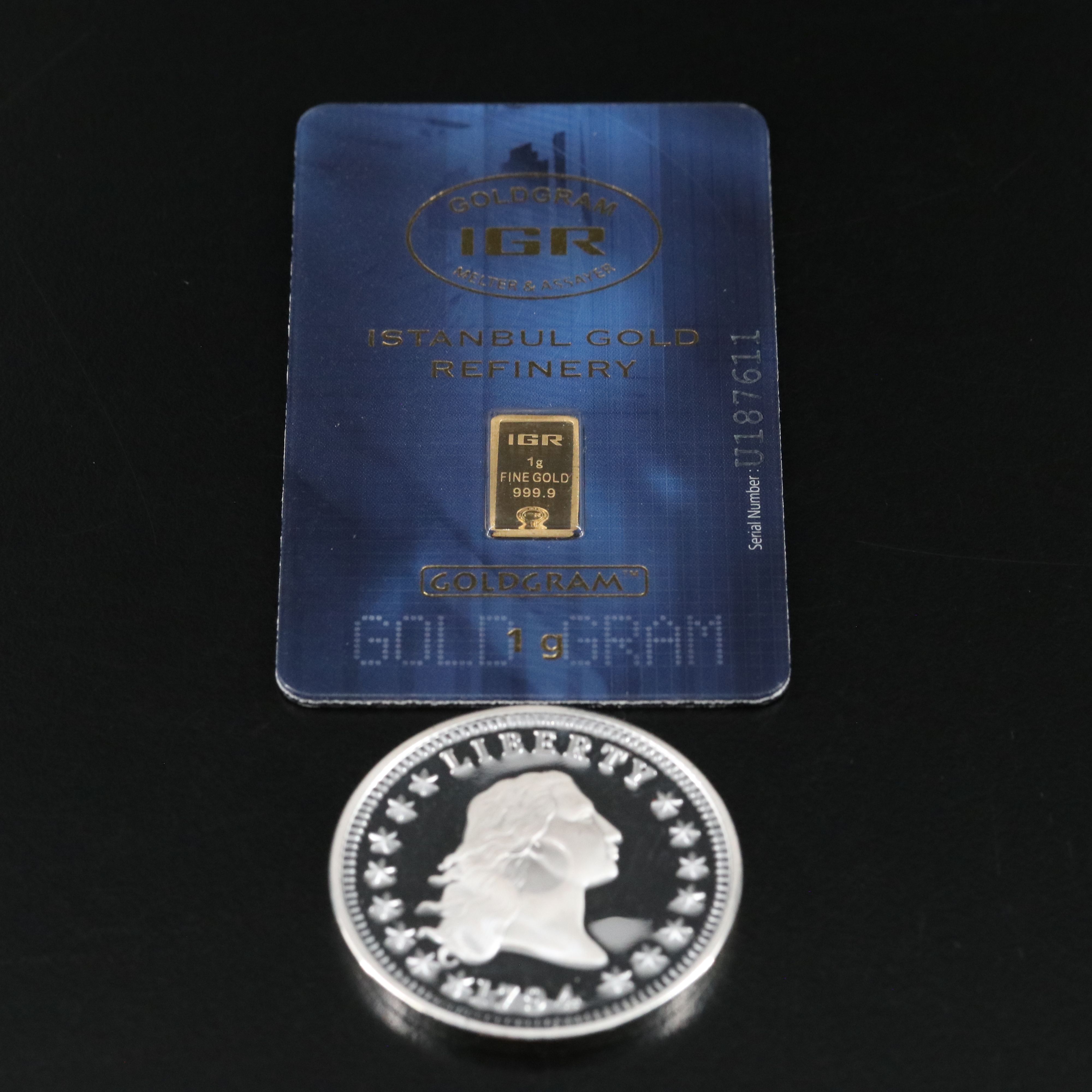 One Gram .9999 Gold Bar and a 1794 Silver Dollar Replica