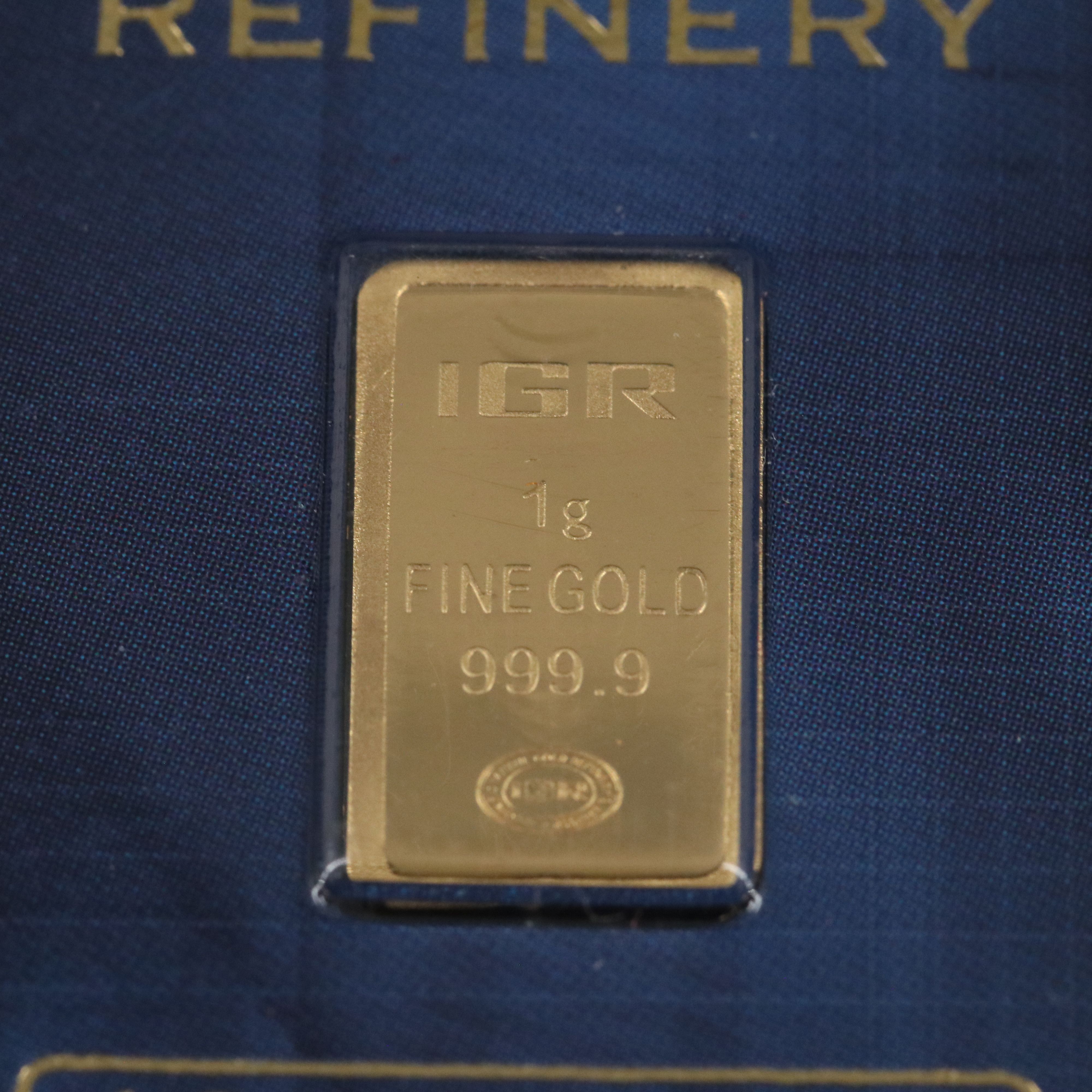 One Gram .9999 Gold Bar and a 1794 Silver Dollar Replica