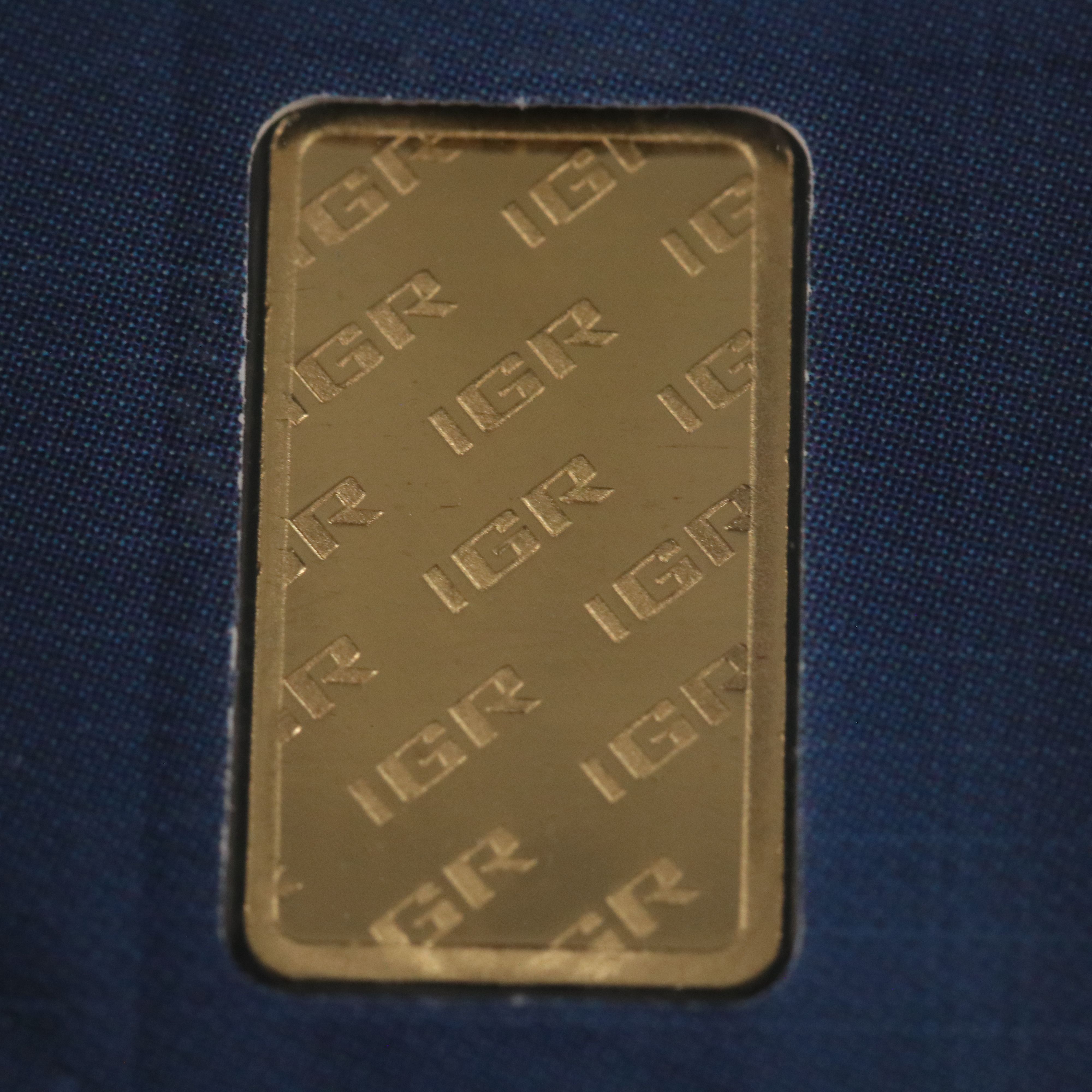 One Gram .9999 Gold Bar and a 1794 Silver Dollar Replica