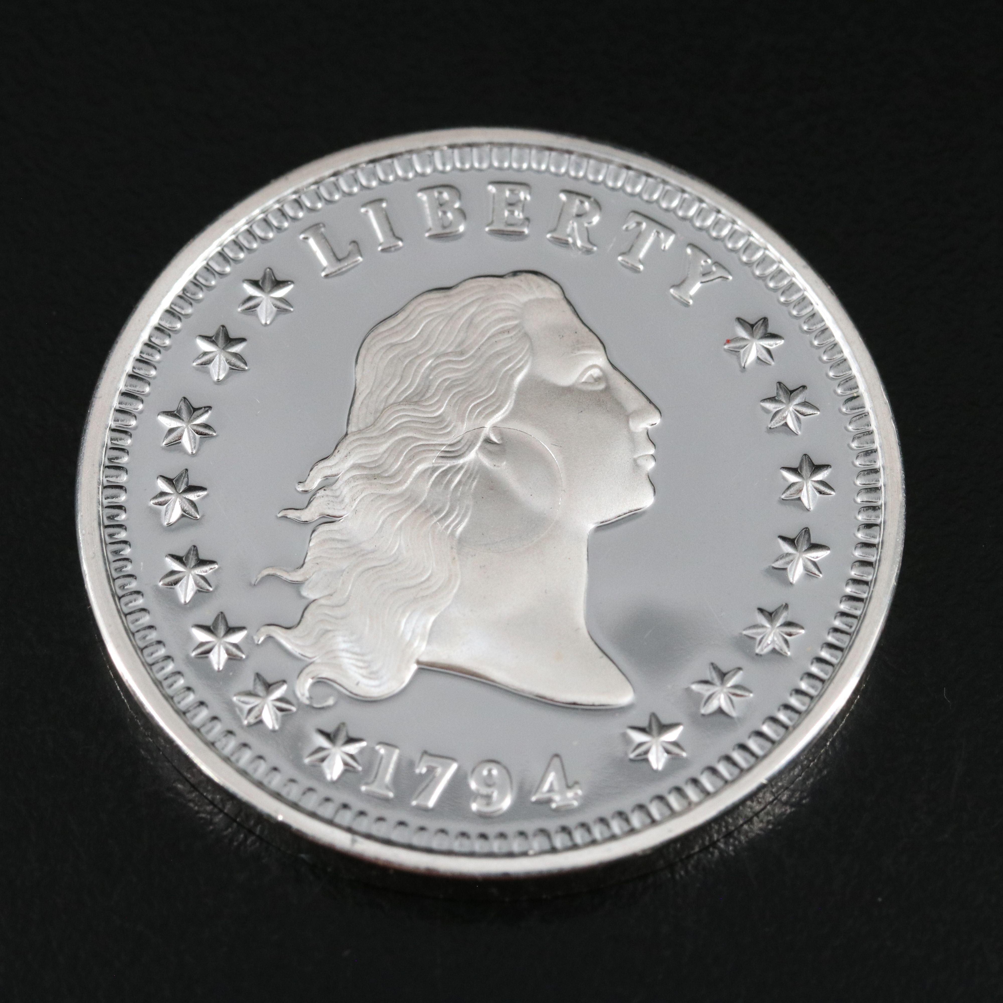 One Gram .9999 Gold Bar and a 1794 Silver Dollar Replica