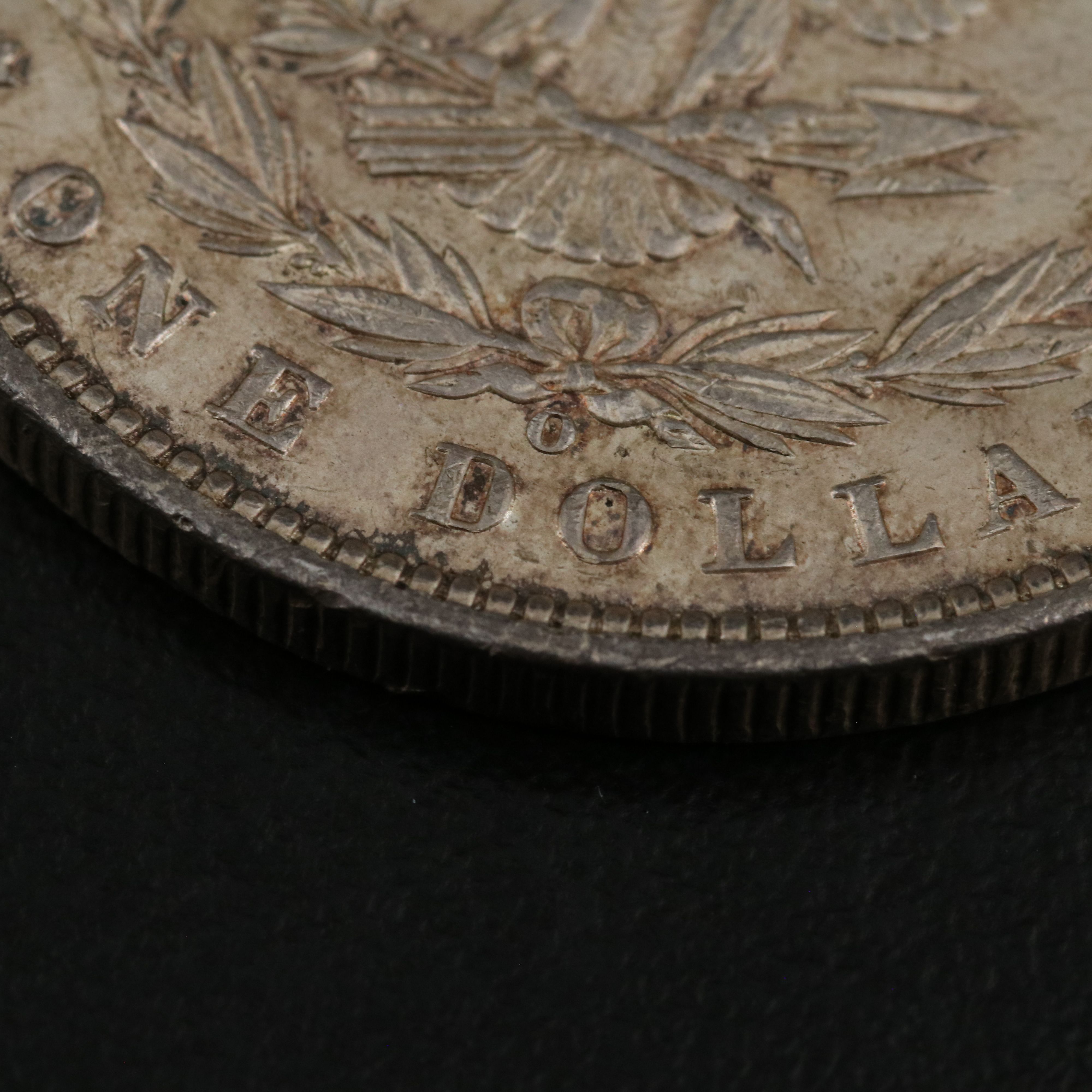 Five Morgan and Peace Dollars with a 1890-O