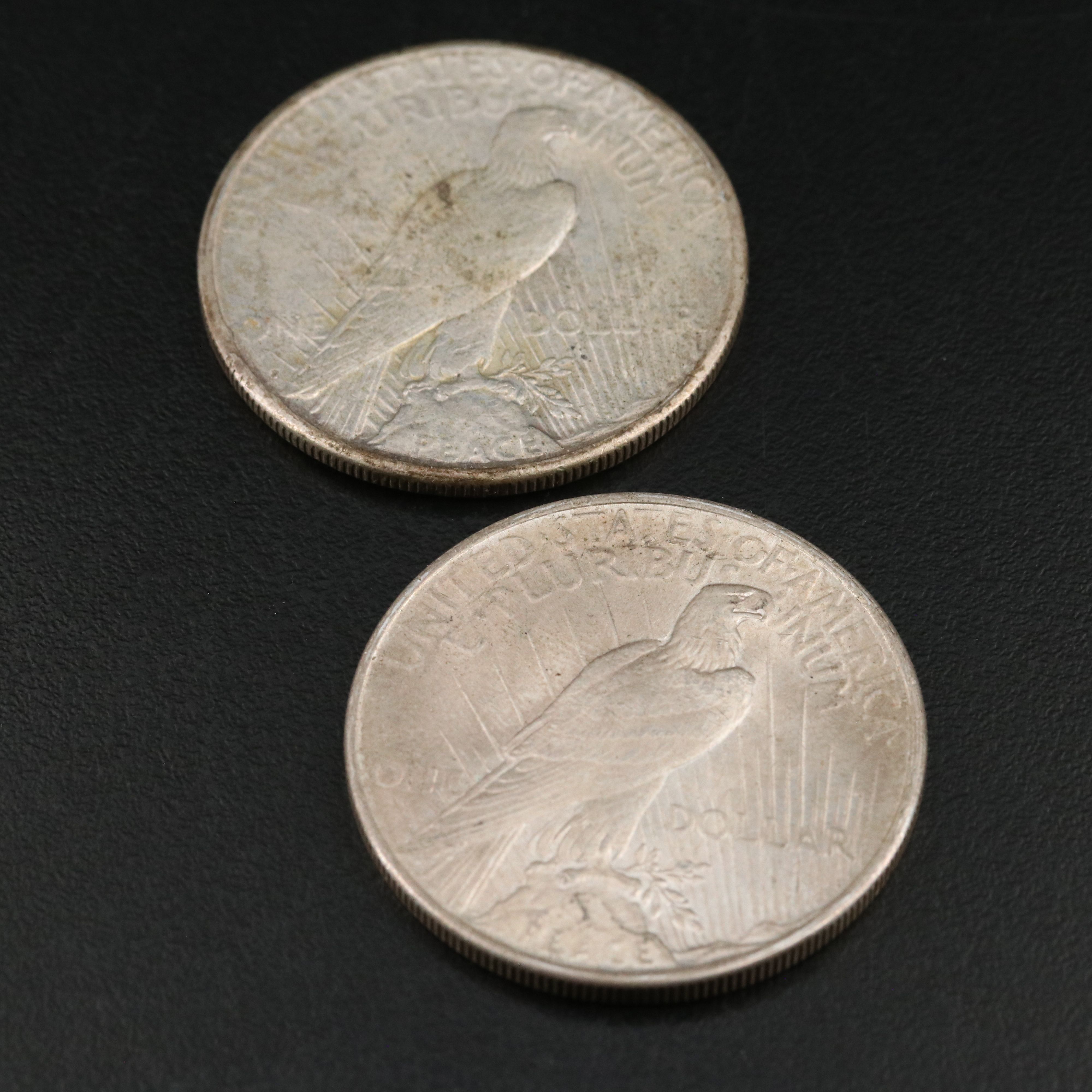 Five Morgan and Peace Dollars with a 1890-O