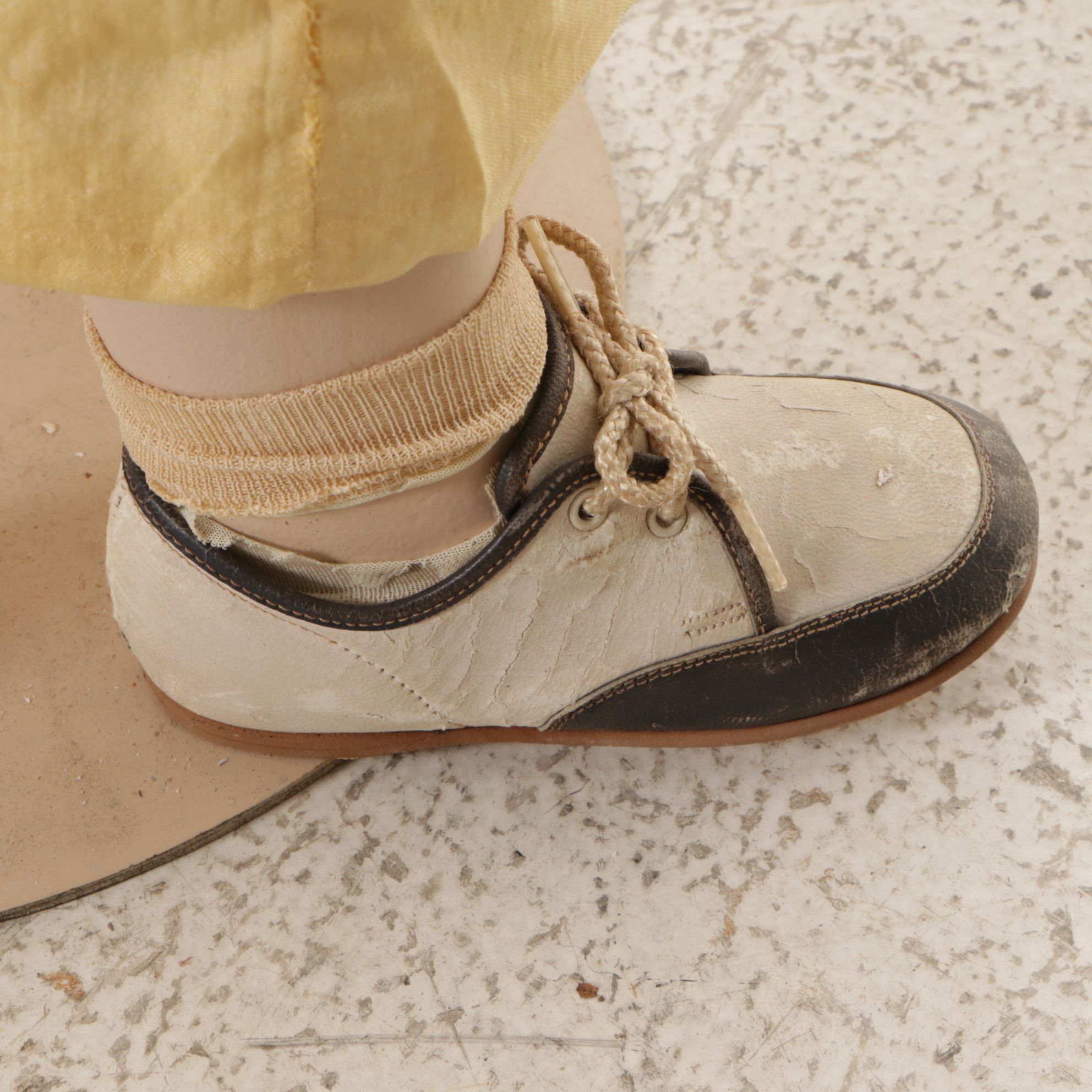 Little Boy Store Mannequin Wearing Yellow Jumper and Shirt