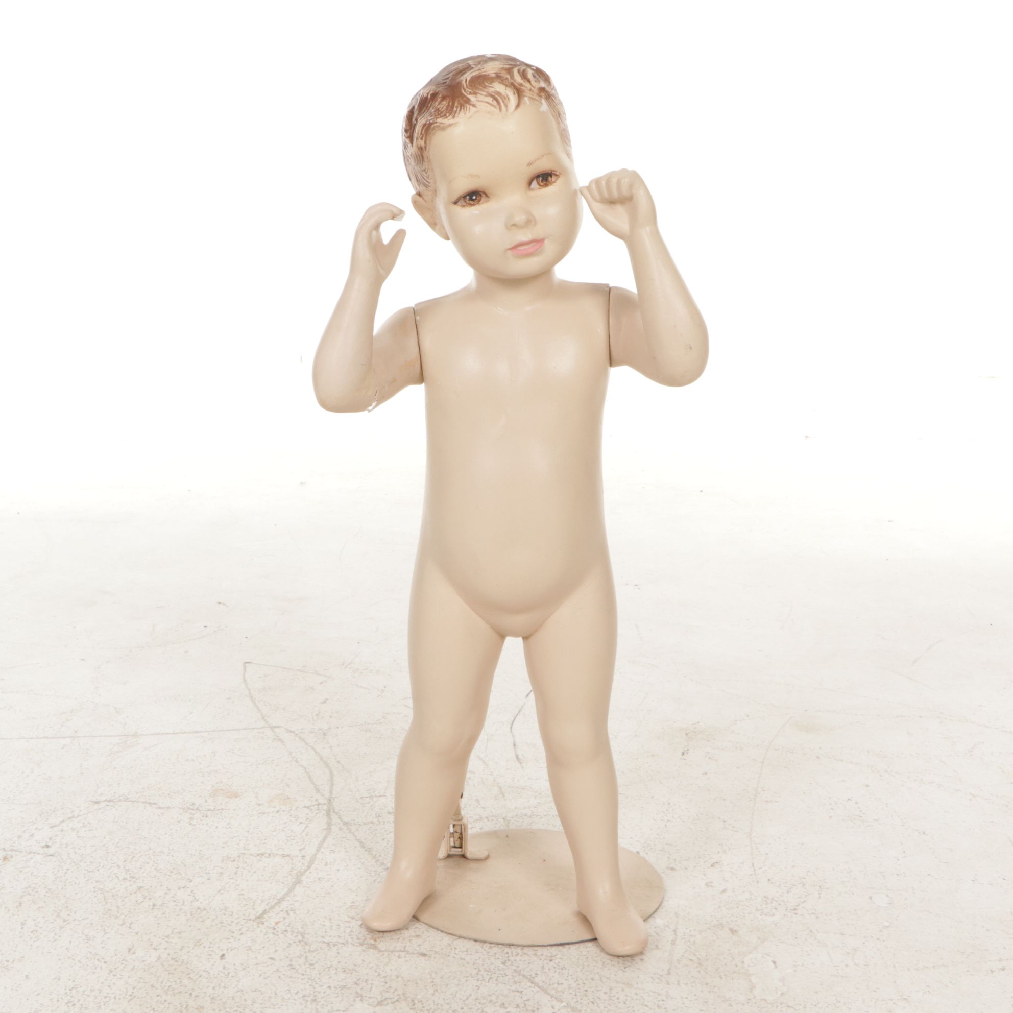 Little Boy Store Mannequin Wearing Yellow Jumper and Shirt