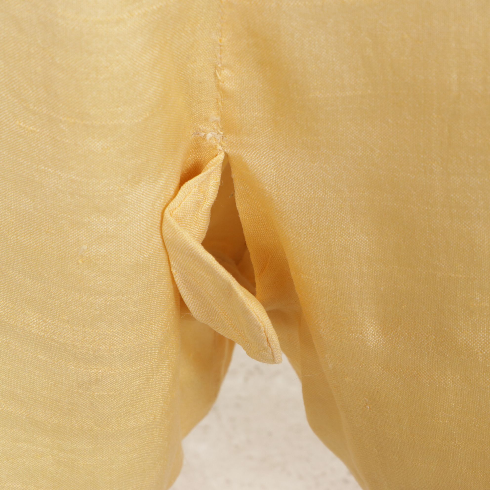 Little Boy Store Mannequin Wearing Yellow Jumper and Shirt