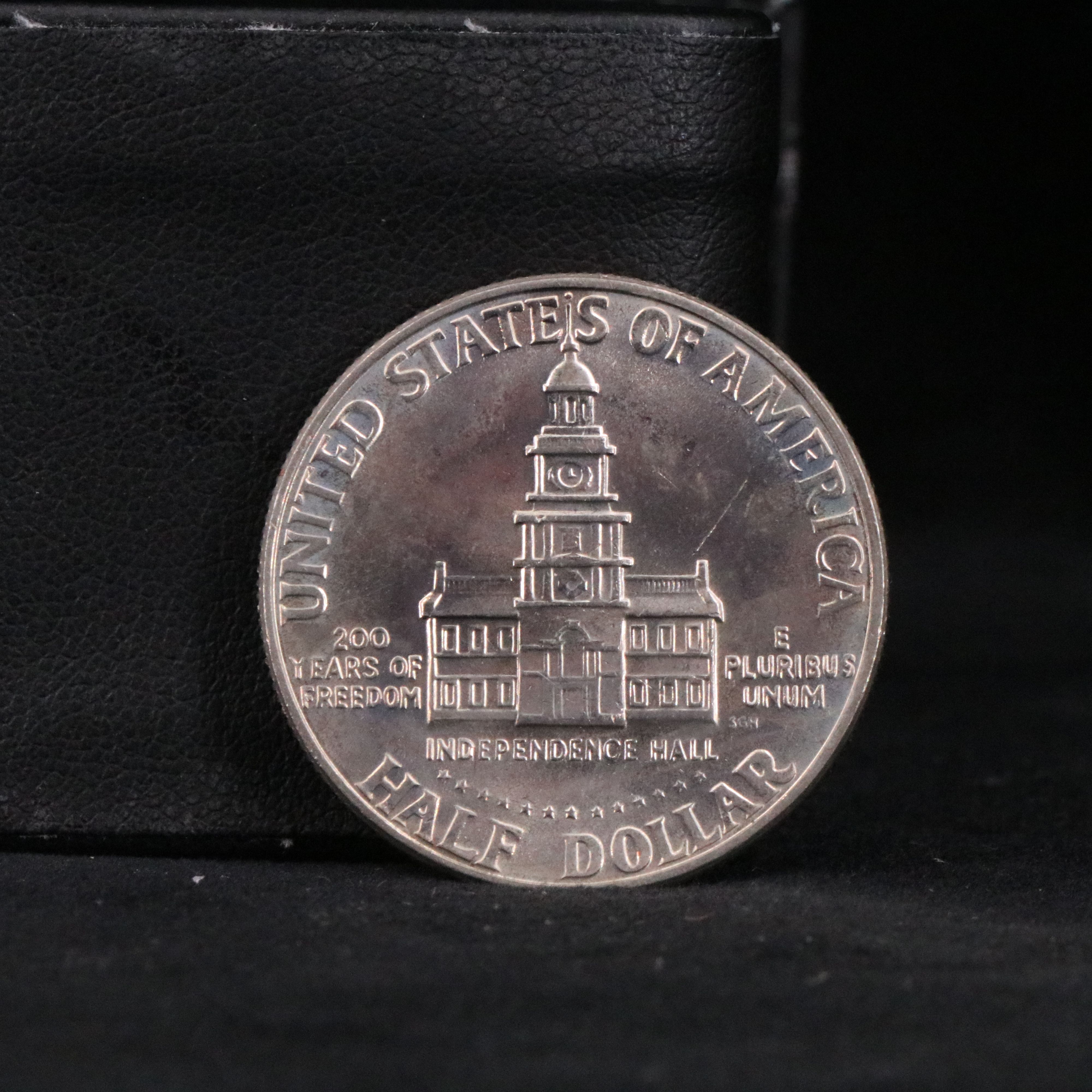 8 Silver Kennedy Half Dollars with 26 Copper-Nickel Bicentennial Half Dollars