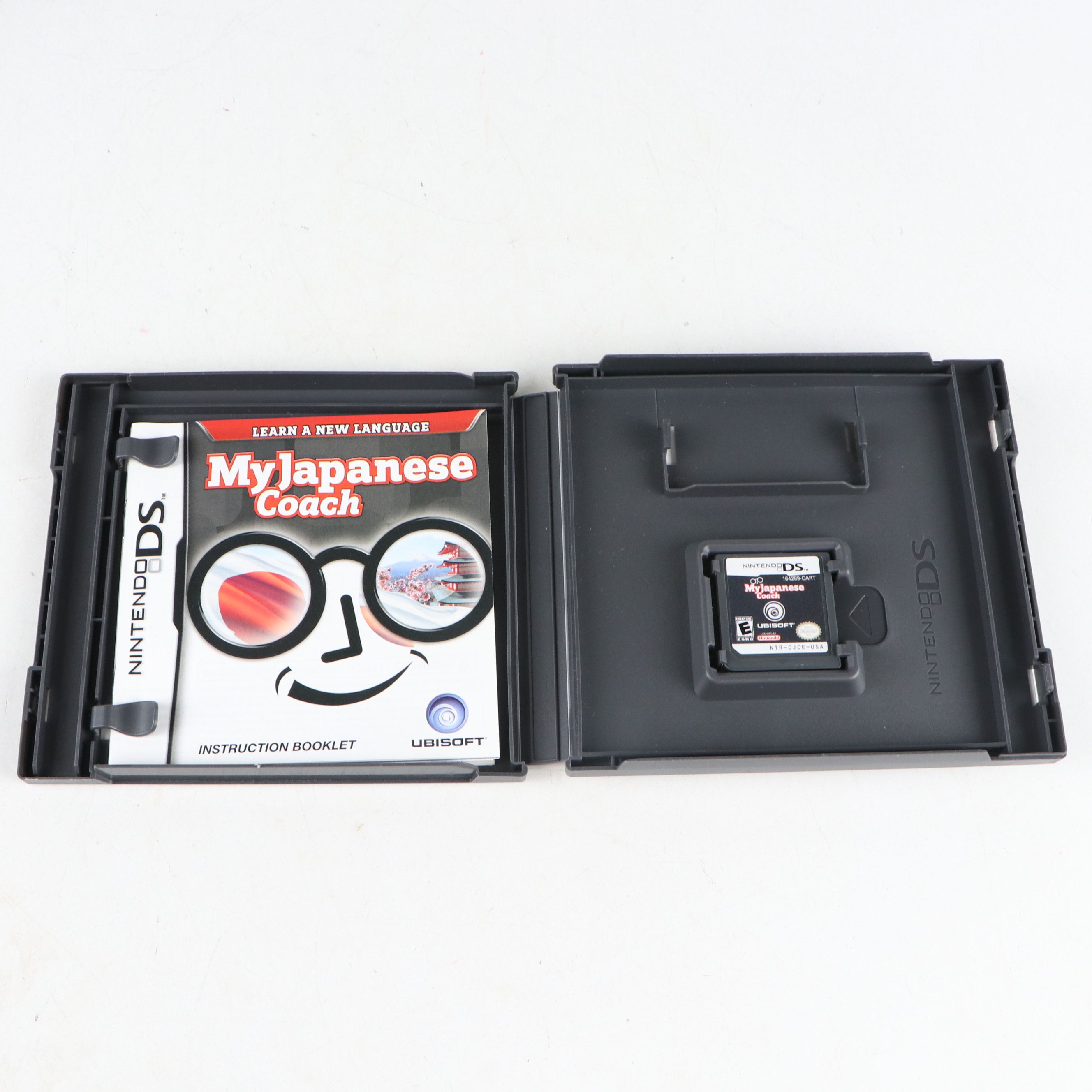 Nintendo DS Console with Brain Age and My Japanese Coach Video Games