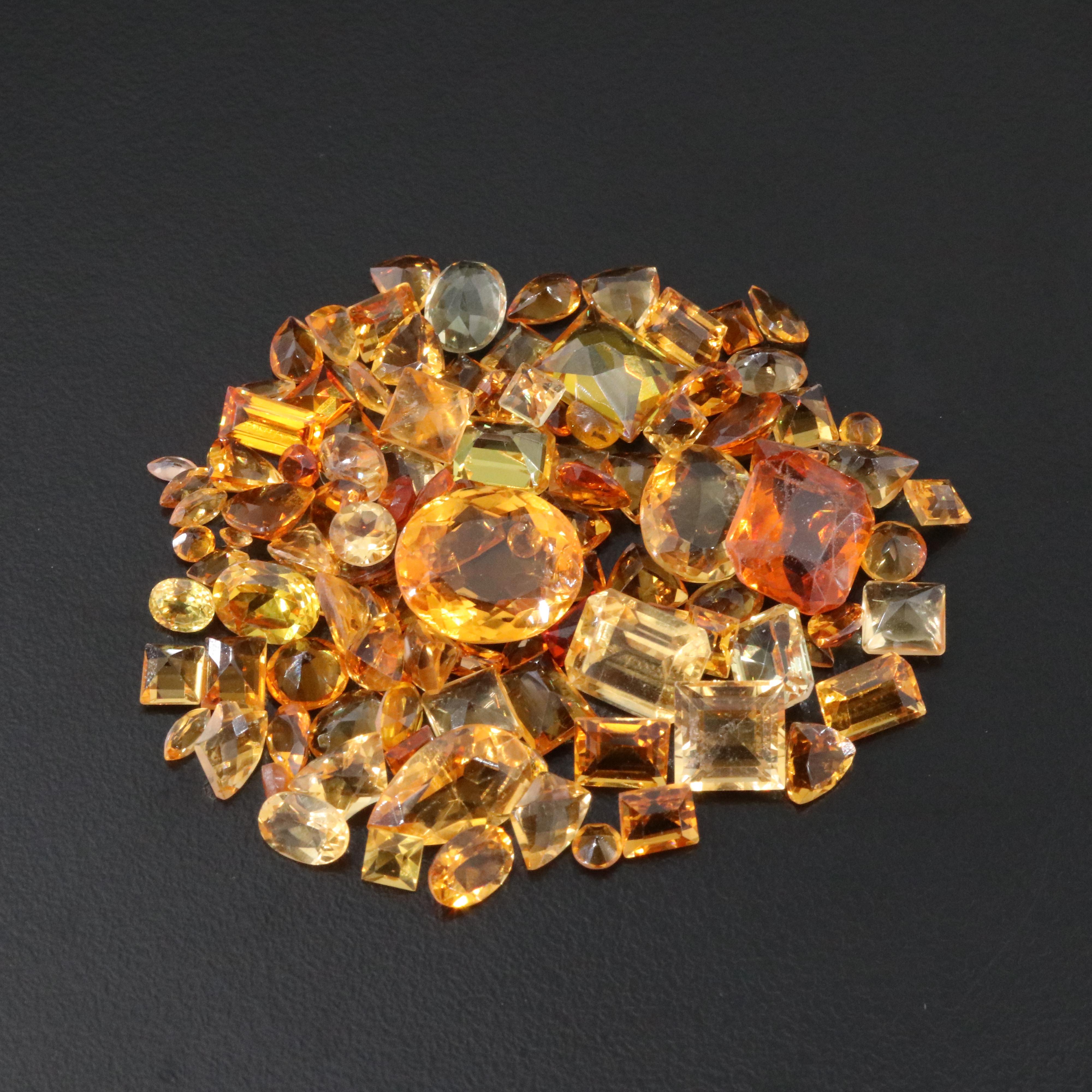 Loose 82.97 CTW Gemstone Lot Including Citrine, Lab Grown Sapphire and Glass