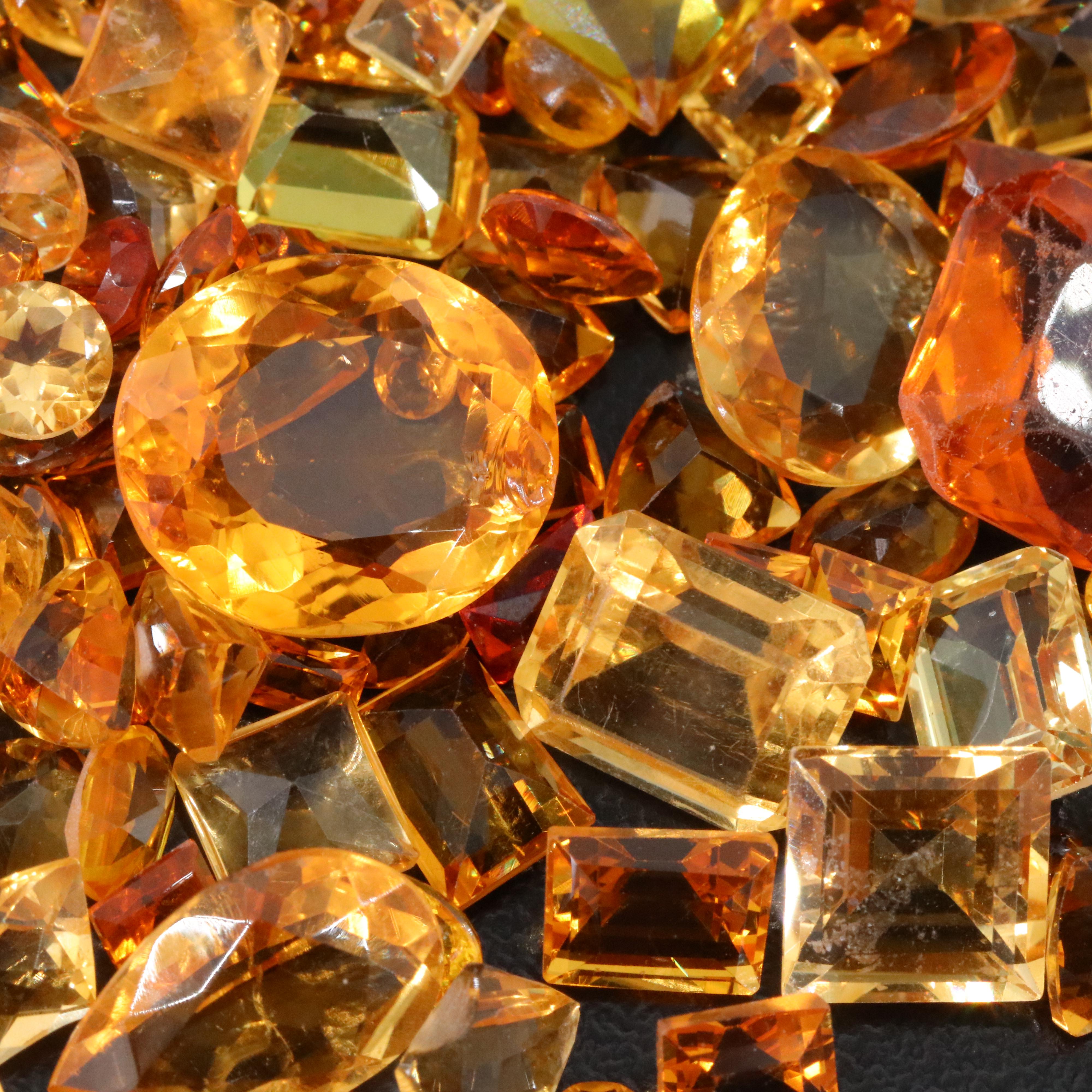 Loose 82.97 CTW Gemstone Lot Including Citrine, Lab Grown Sapphire and Glass