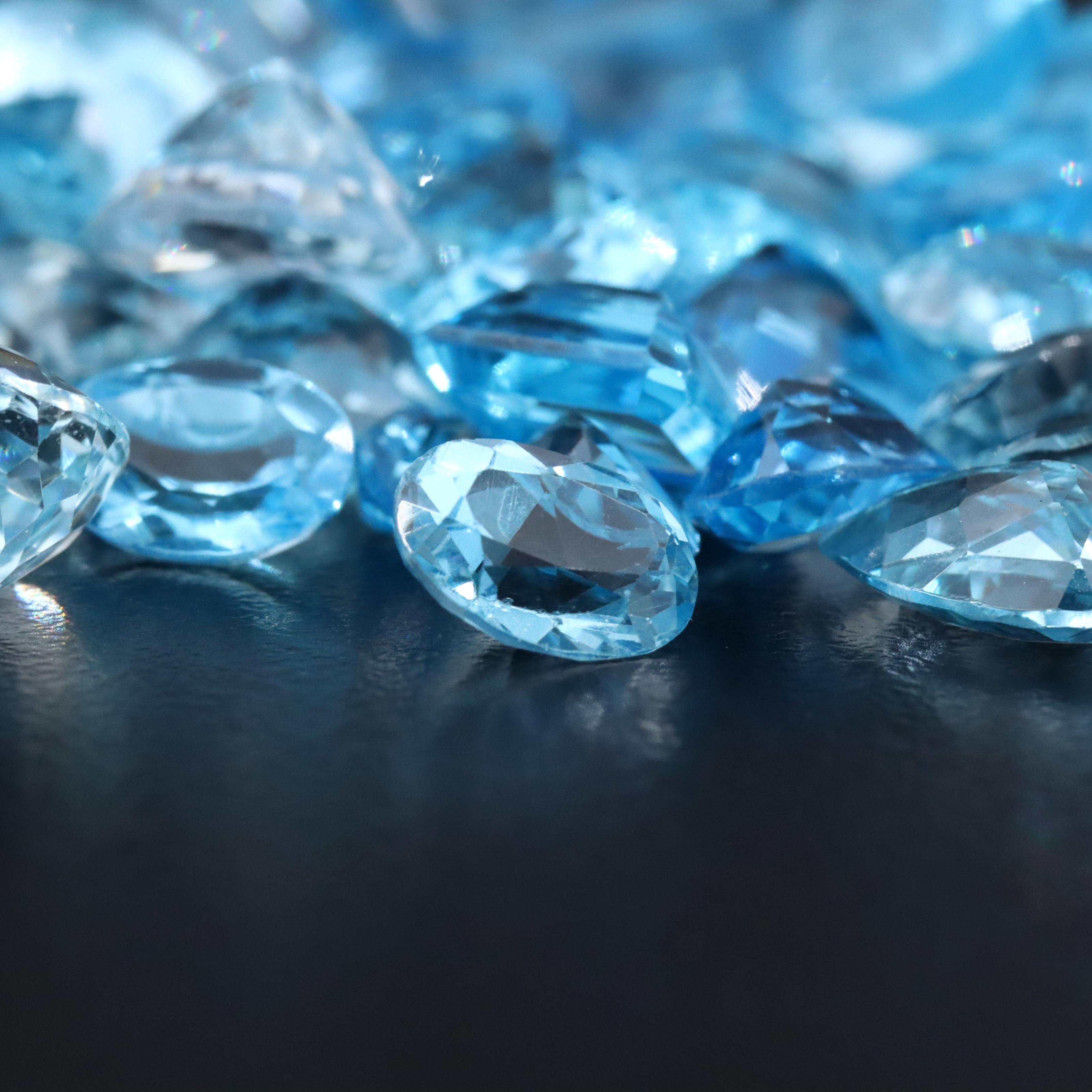 Loose 128.54 CTW Aquamarine and Topaz Assortment