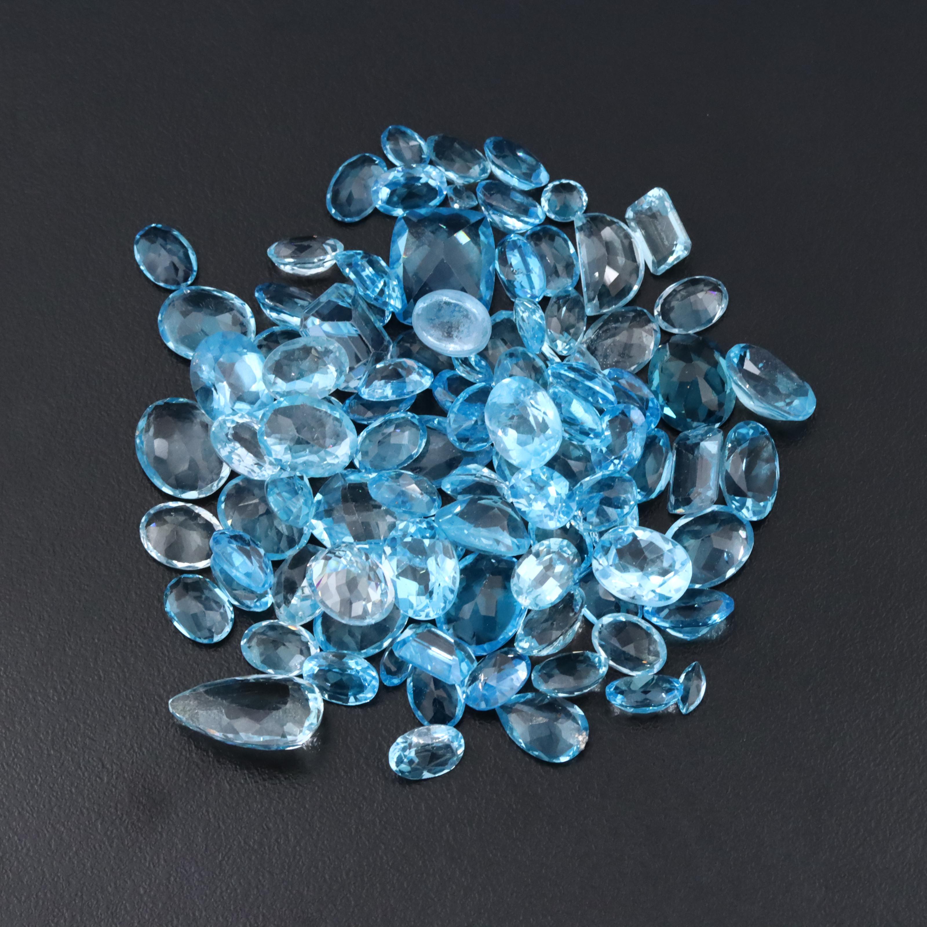 Loose 128.54 CTW Aquamarine and Topaz Assortment