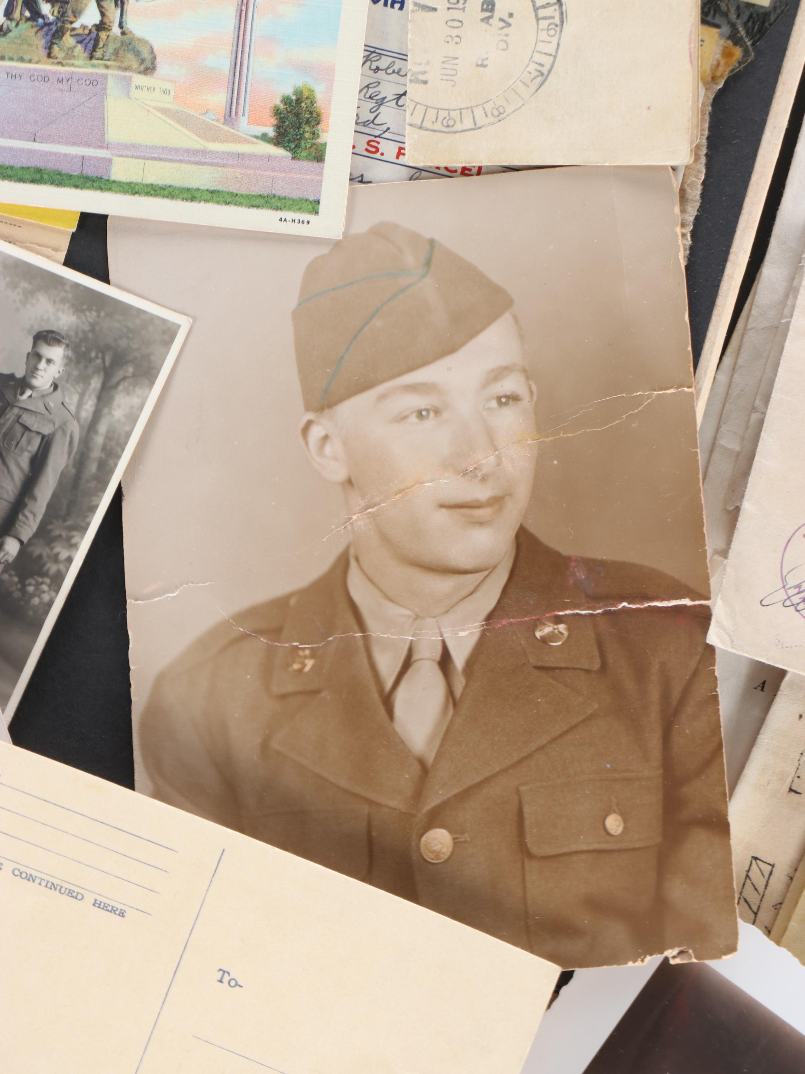 World War II Era Memorabilia Featuring US Army Bags and Photos inside Wood Trunk