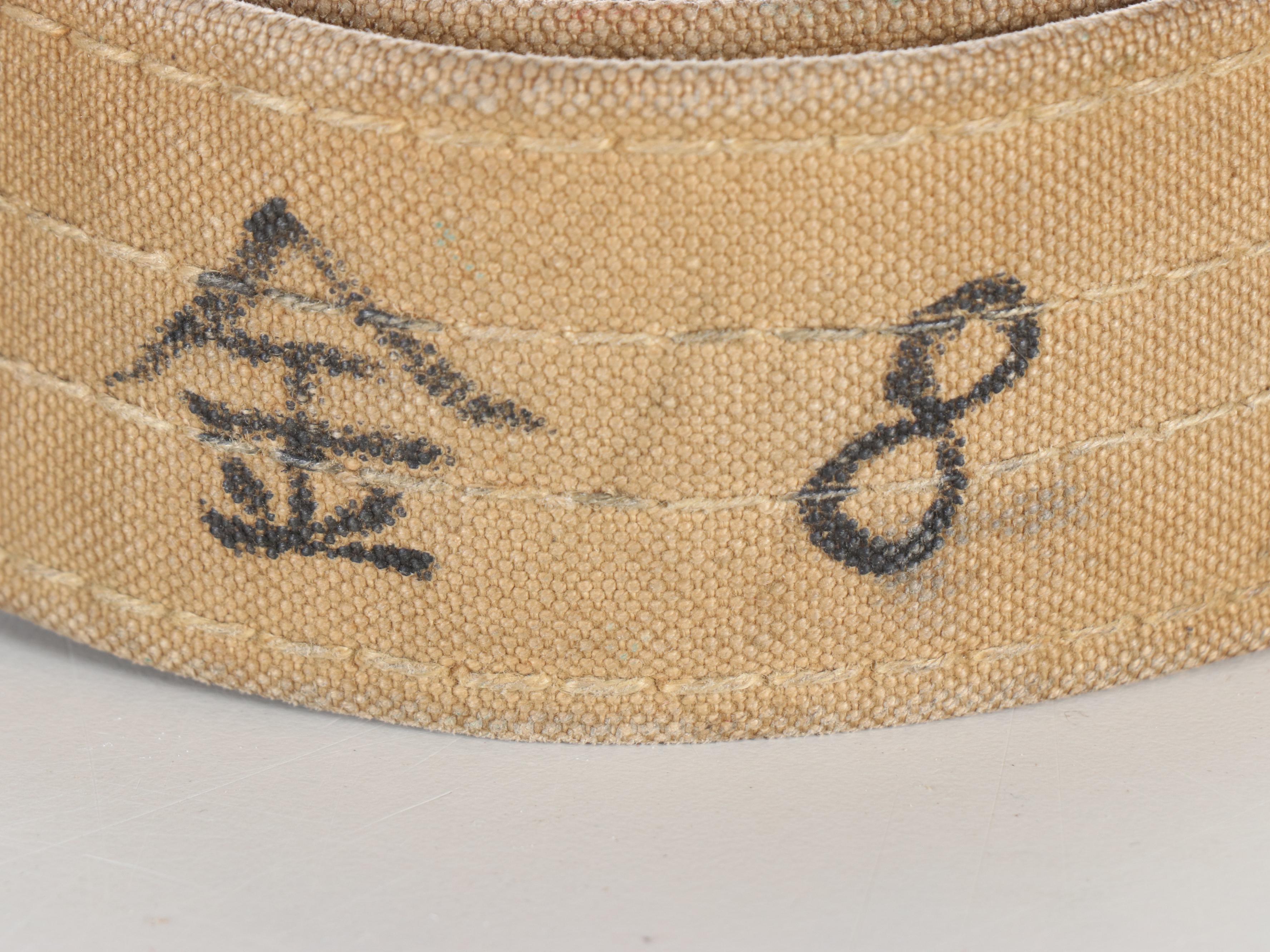 World War II Era Memorabilia Featuring US Army Bags and Photos inside Wood Trunk