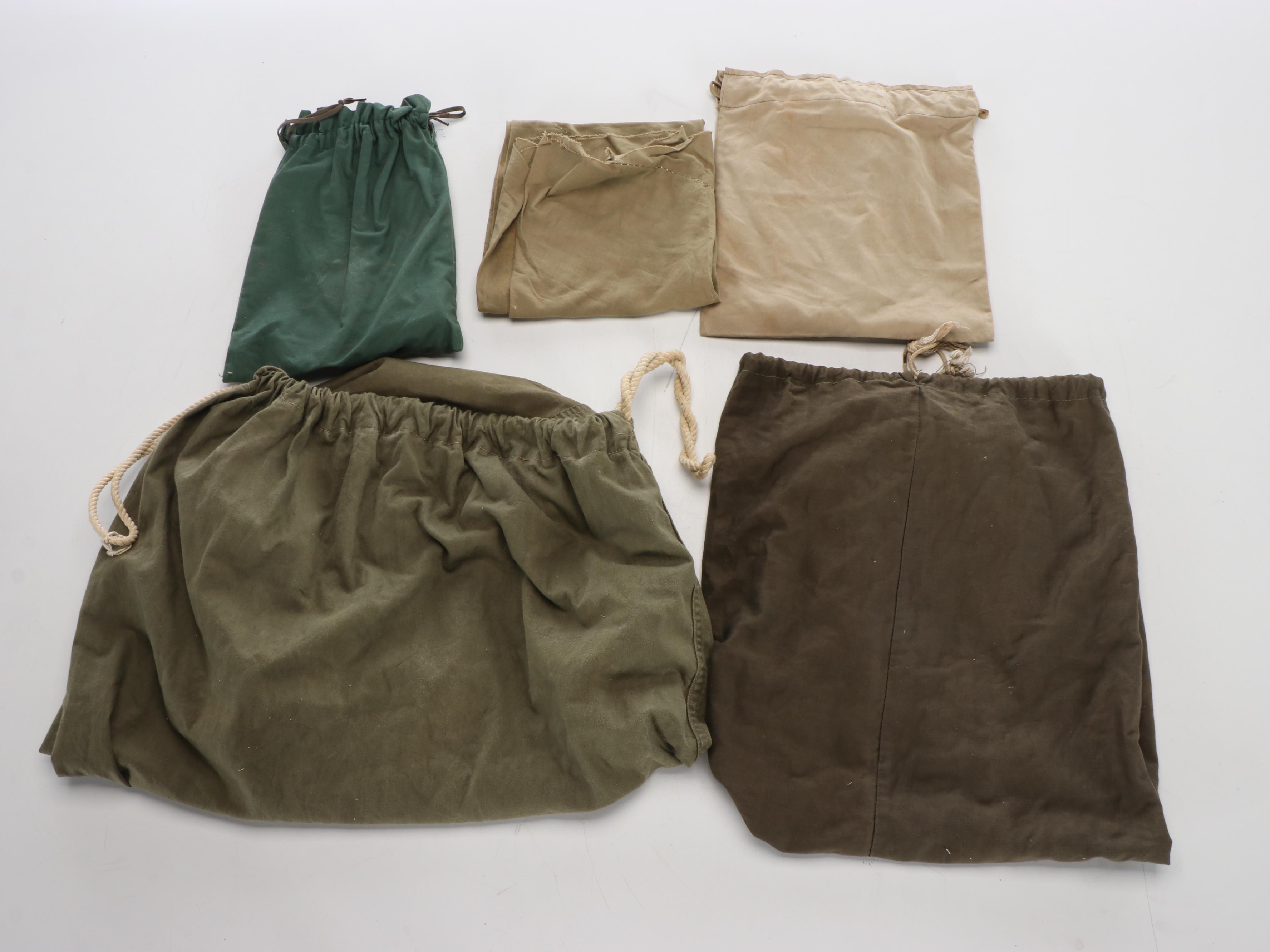 World War II Era Memorabilia Featuring US Army Bags and Photos inside Wood Trunk