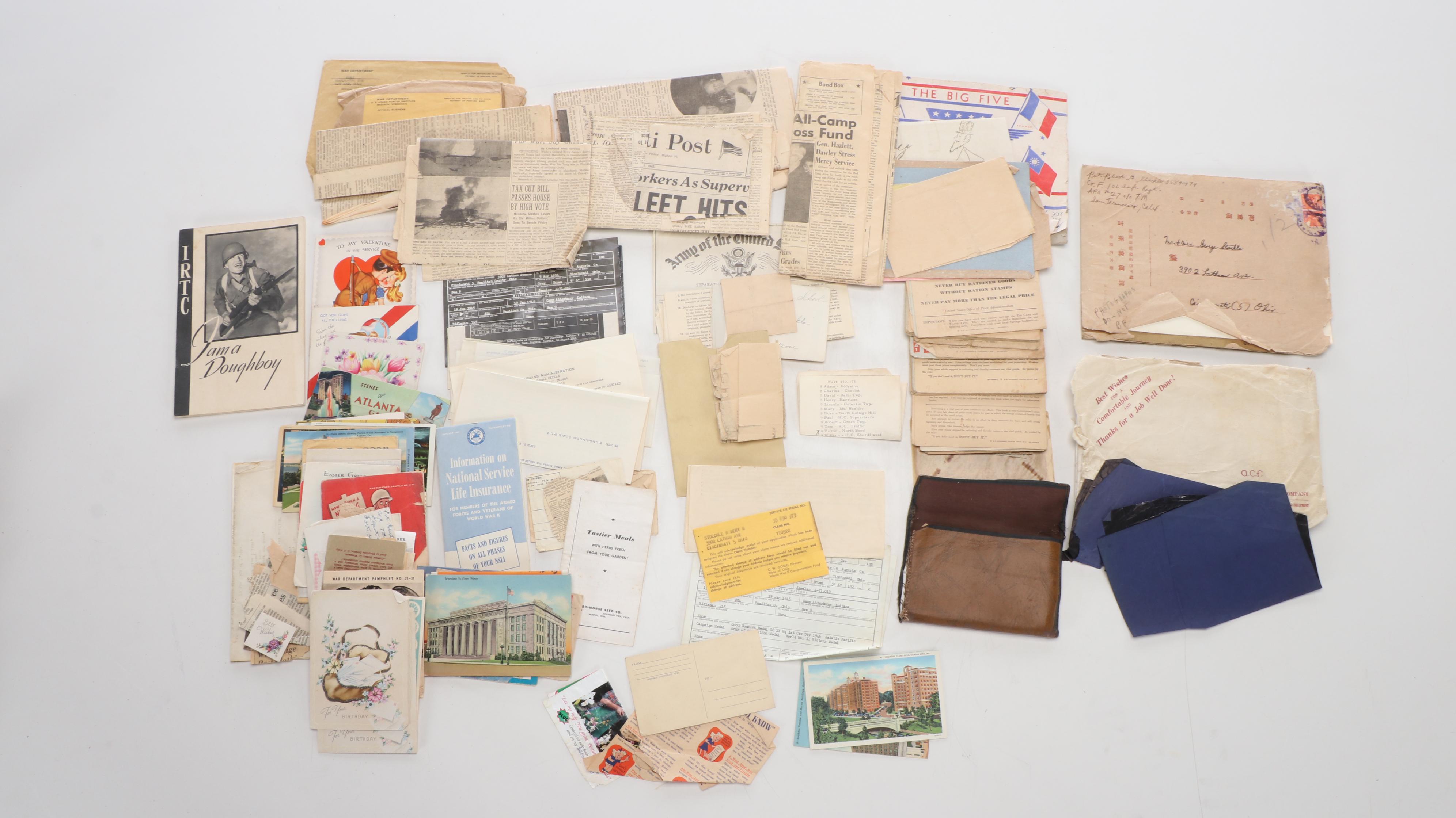 World War II Era Memorabilia Featuring US Army Bags and Photos inside Wood Trunk