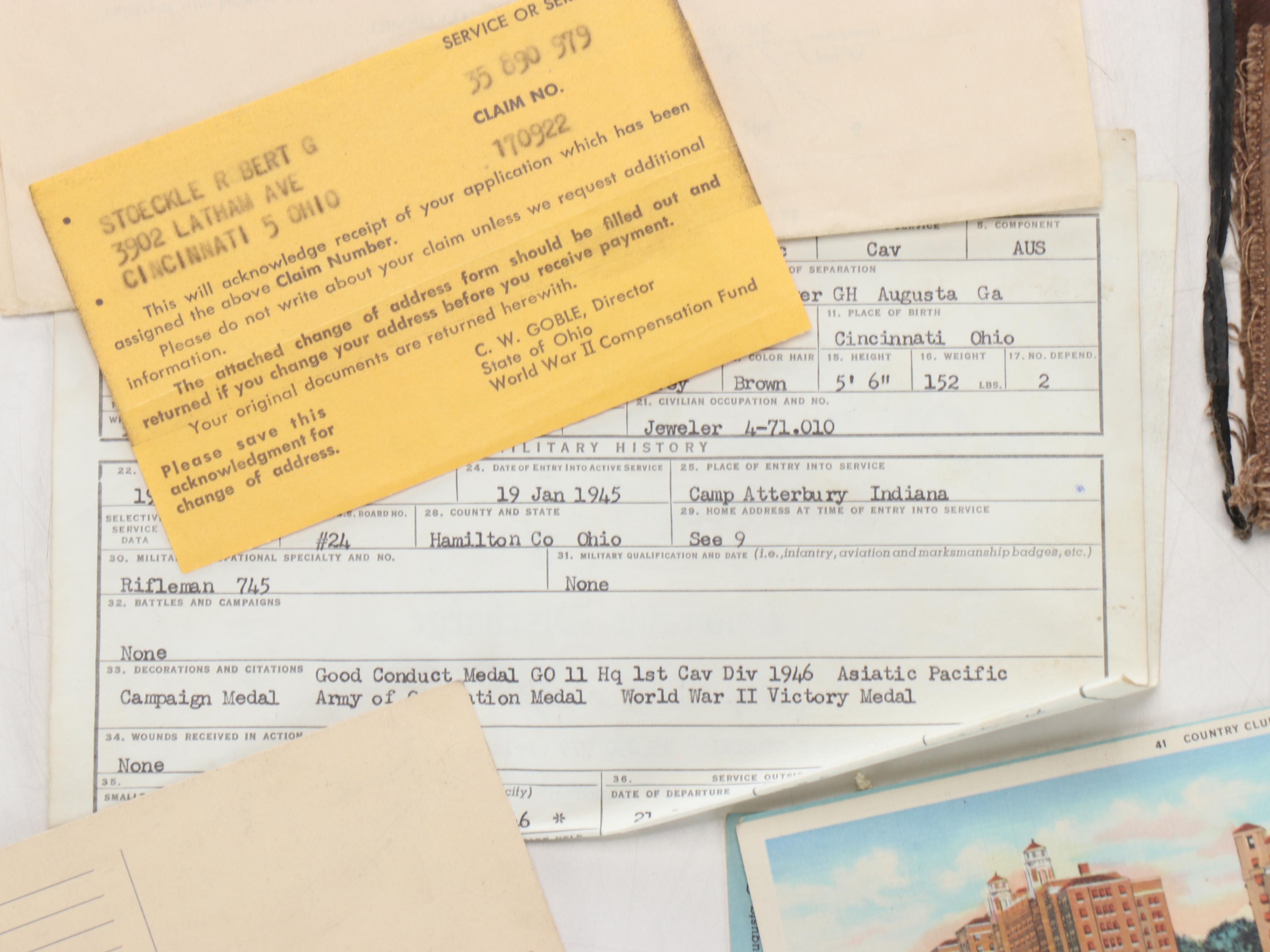 World War II Era Memorabilia Featuring US Army Bags and Photos inside Wood Trunk