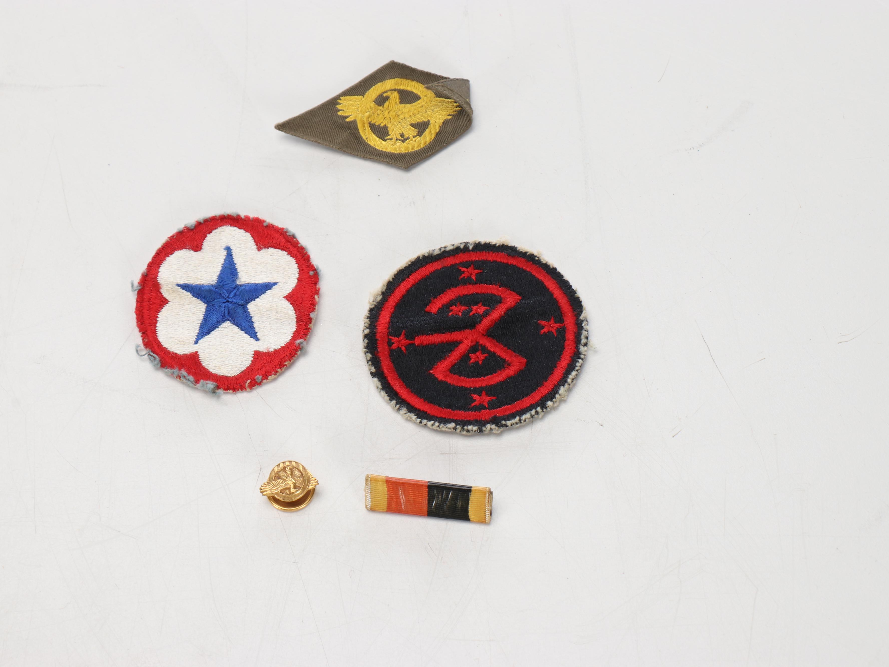 World War II Era Memorabilia Featuring US Army Bags and Photos inside Wood Trunk