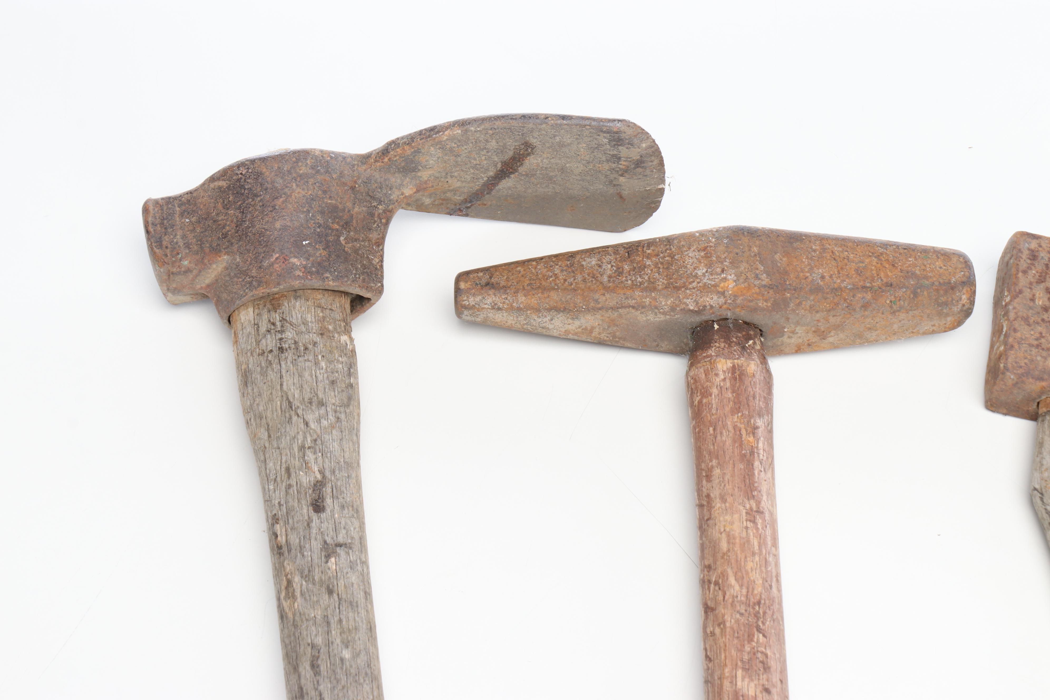 Vintage Scythe, Railroad Spike Driver, Axe, and Other Hand Tools