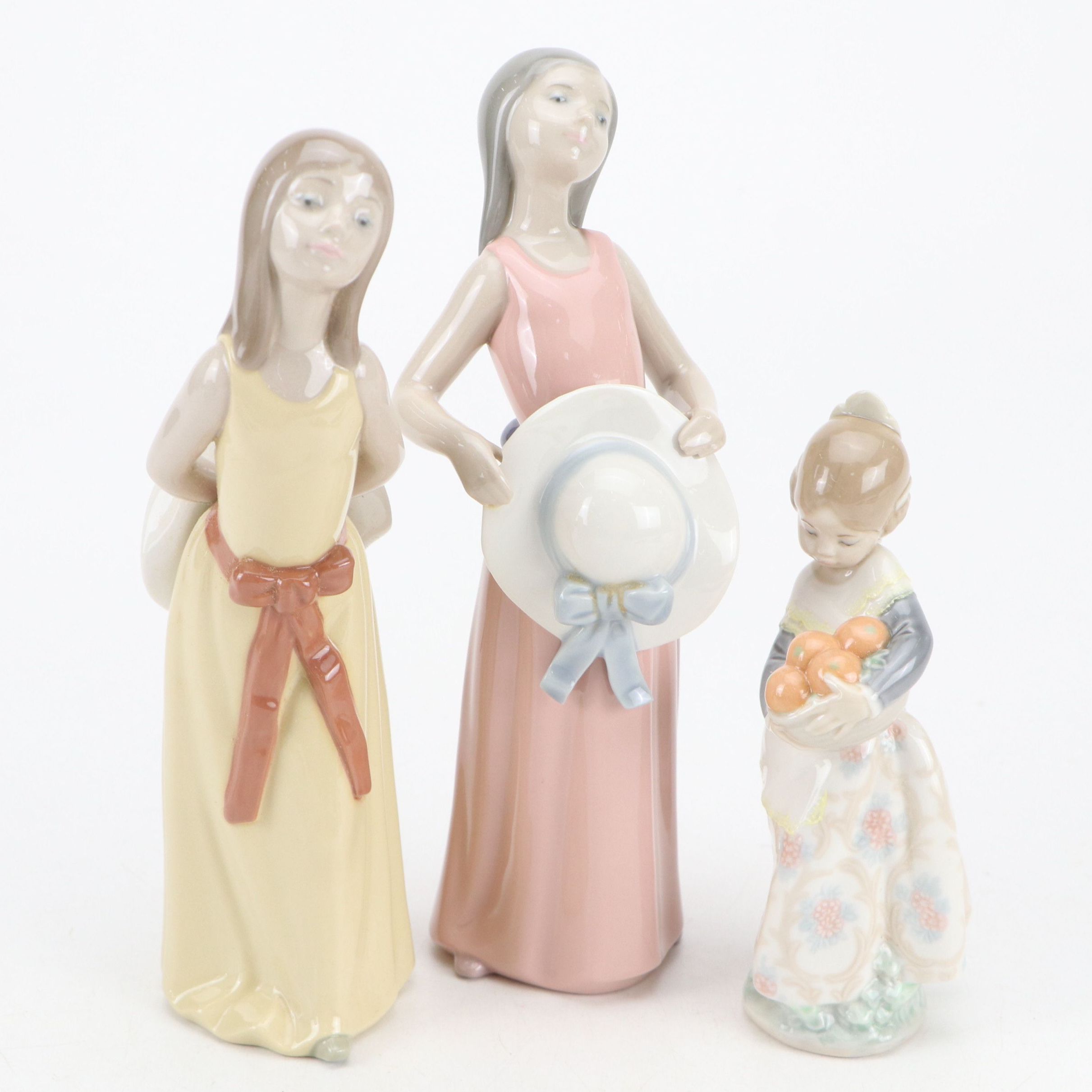 Lladró "Dreamer," "Naughty," and "Valencian Girl" Porcelain Figurines