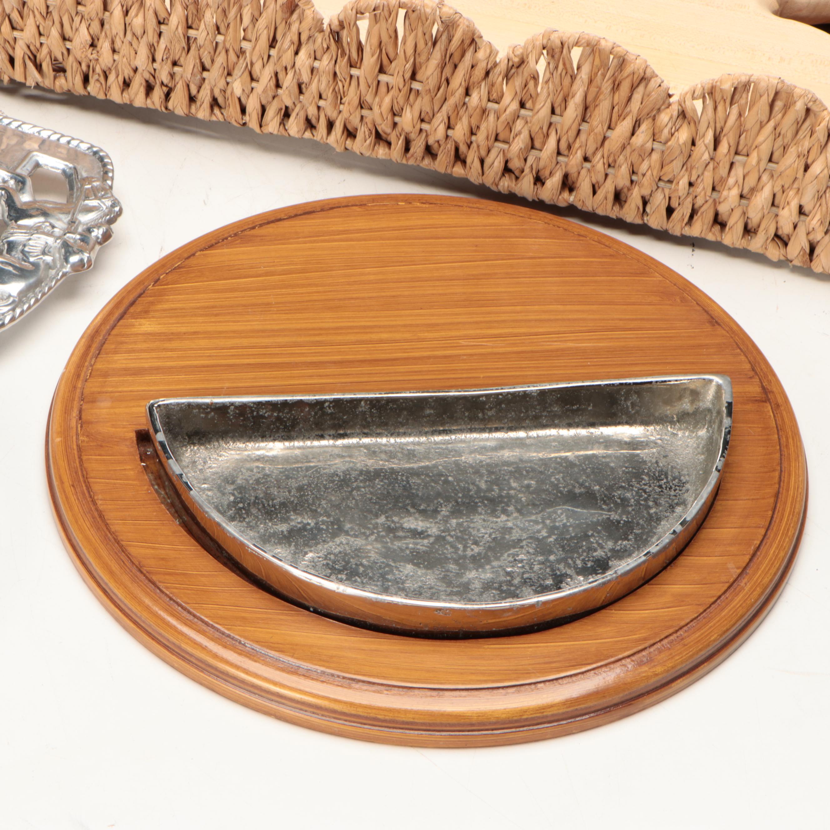 Wicker Tray with Nambé Metal Tray and Plates and Other Wood Cutting Boards